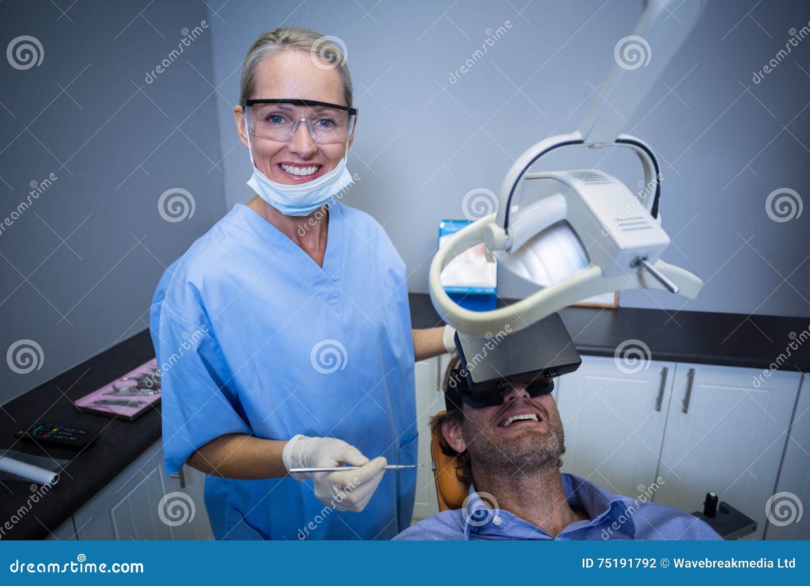 Man Using Virtual Reality Headset during a Dental Visit Stock Photo