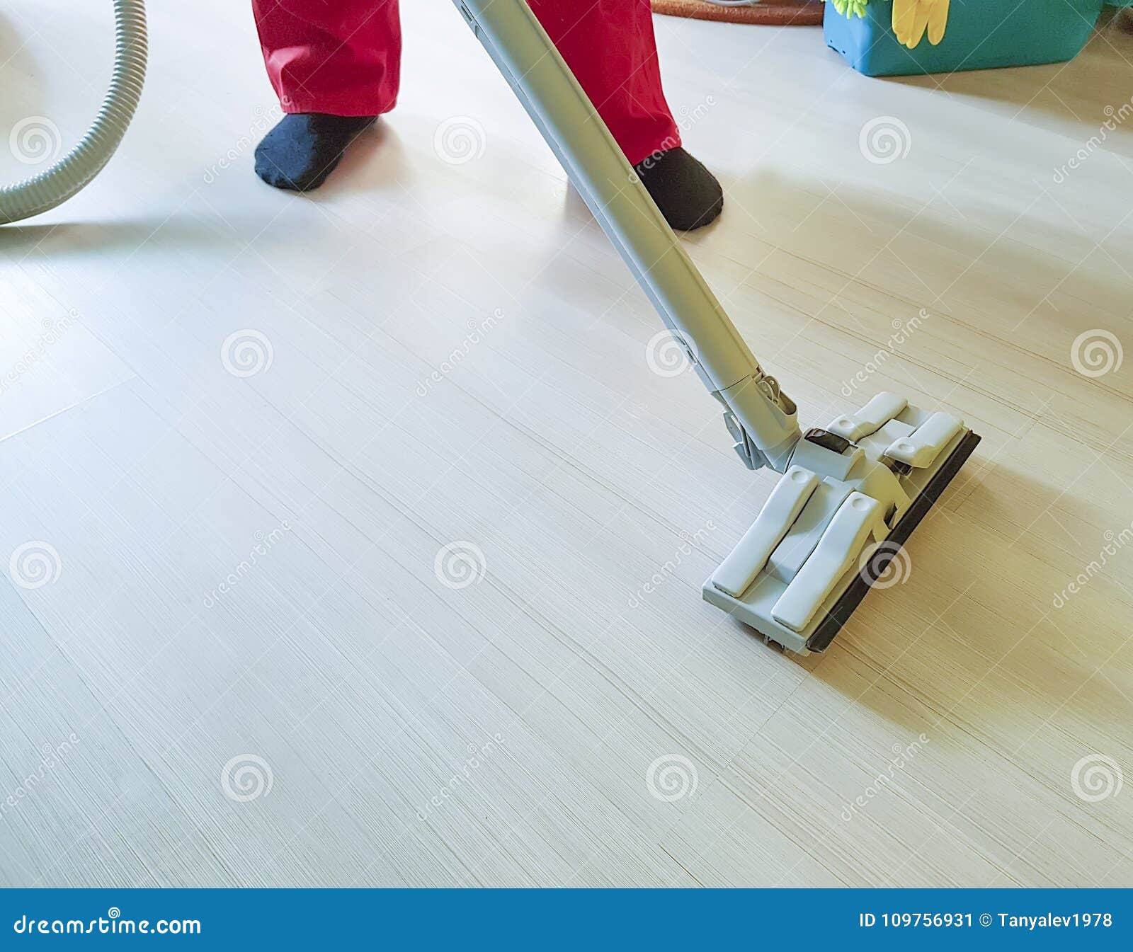 Man Vacuuming The Floor In The Room Keeping Equipment Cleaning