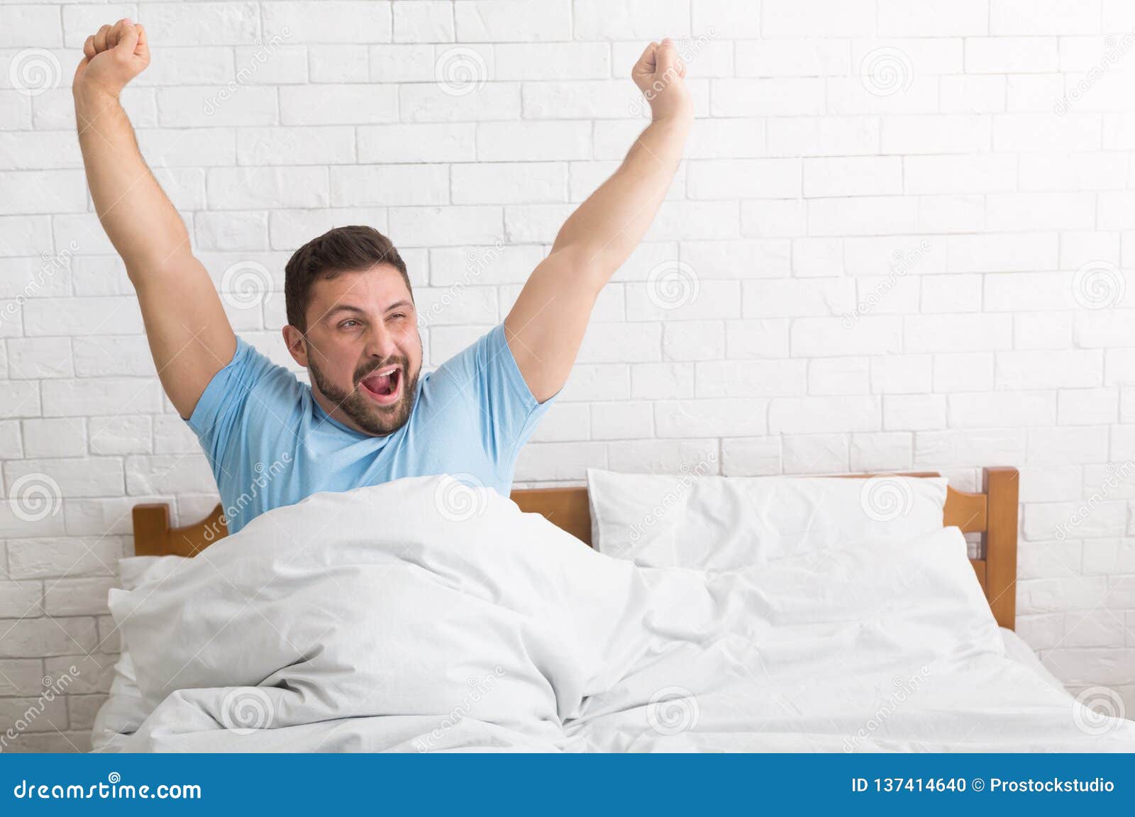 Man Waking Up in Morning, Stretching and Yawning Stock Photo Image of