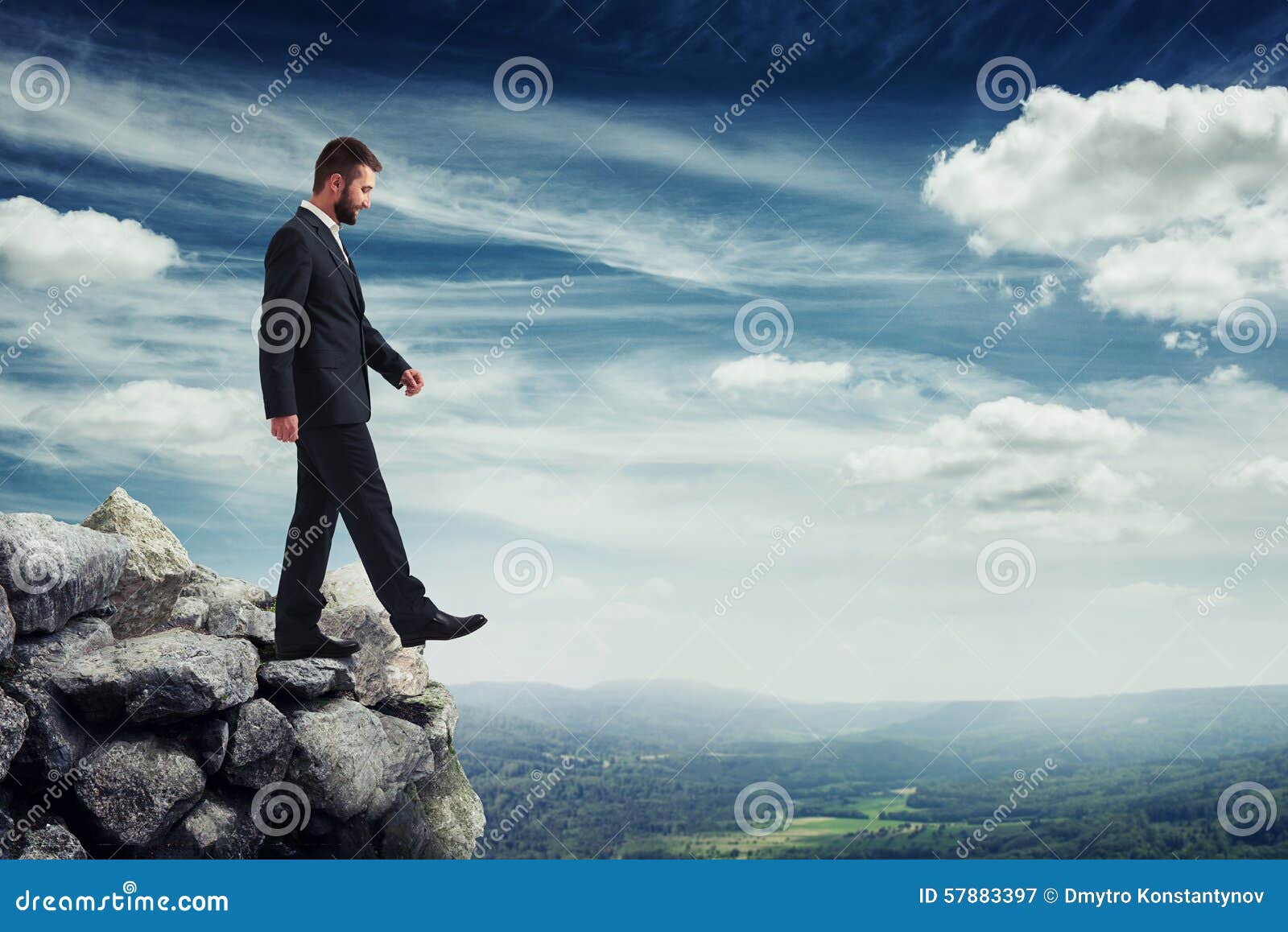 man walking on the brink of a precipice