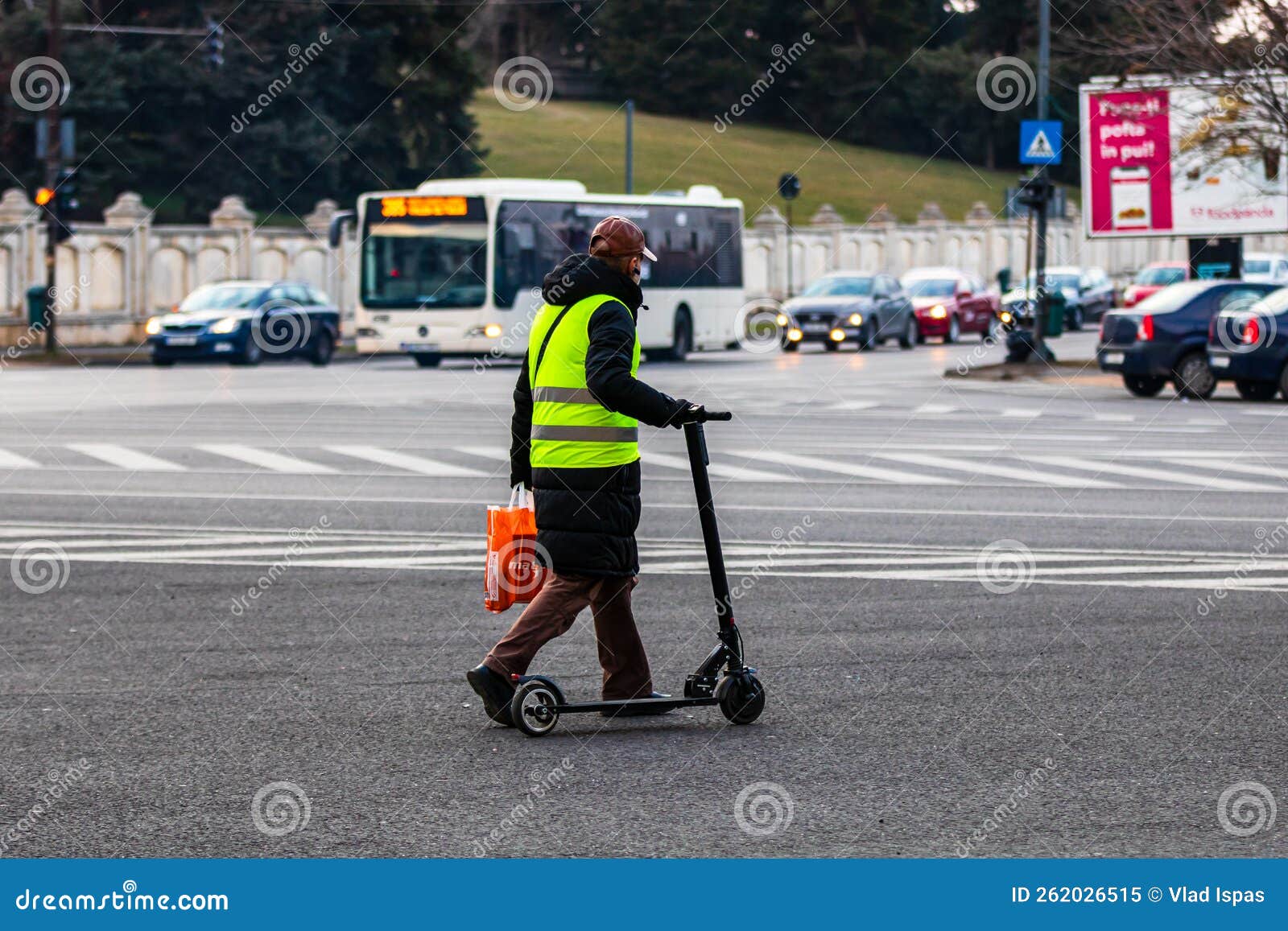 Man Walking Next To a Electric Scooter in Bucharest, Romania, 2022