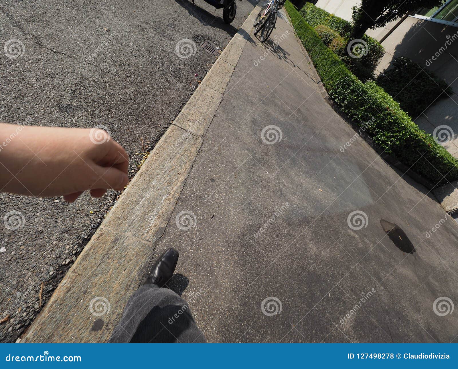 Man walking on pavement stock photo. Image of marriage 127498278