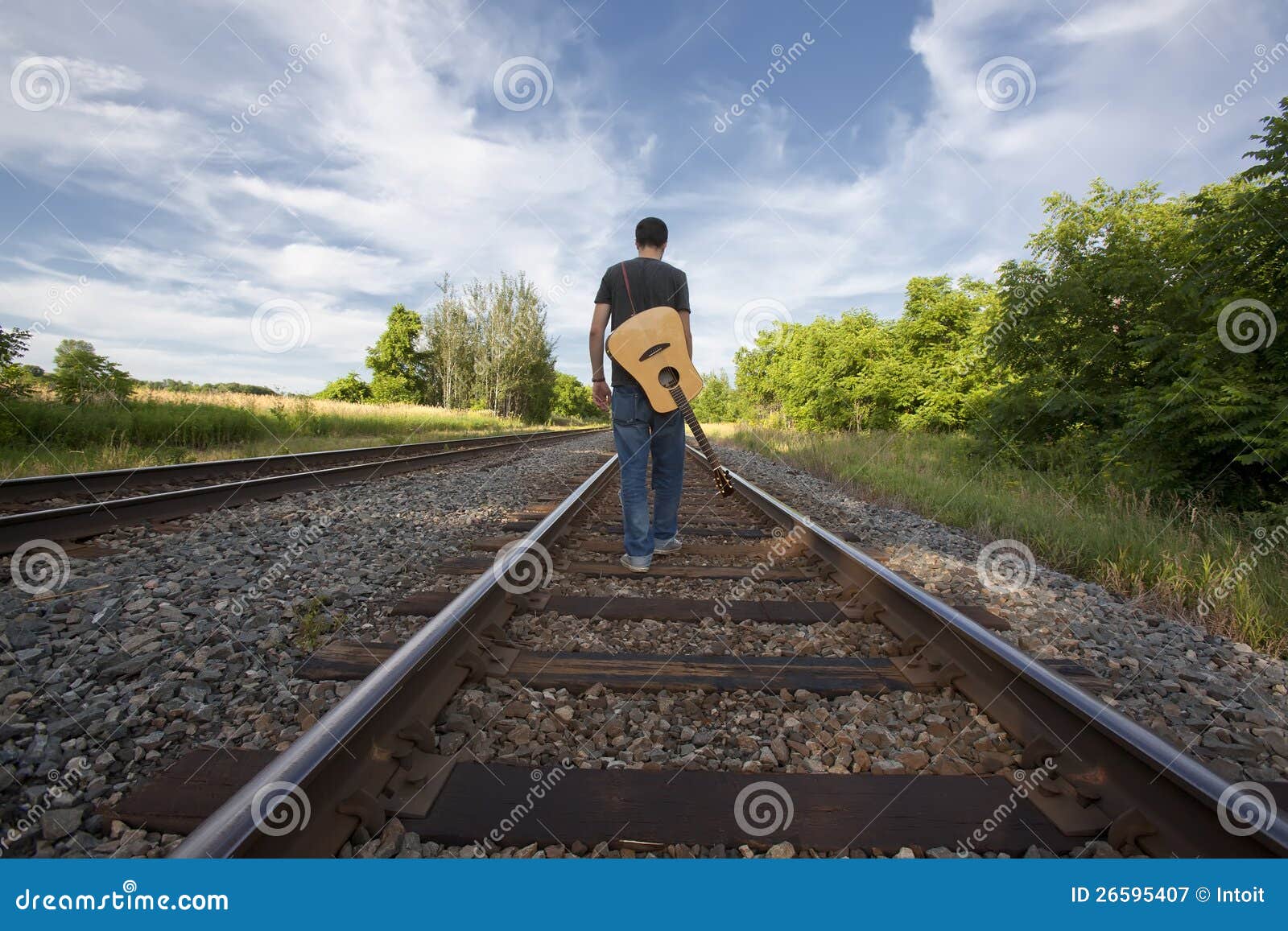 Royalty Free Stock Photography: Man Walking Rail Road Tracks with 