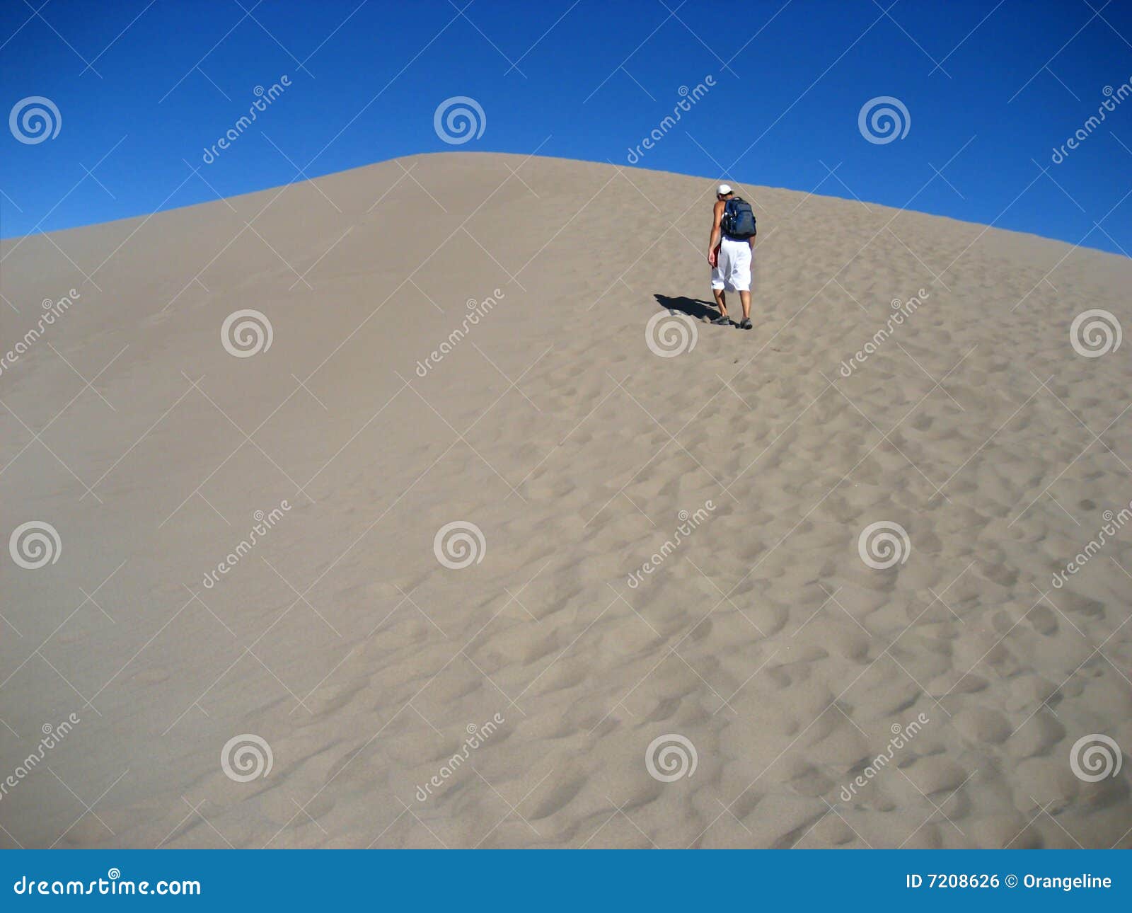 Man Walking on Sand stock photo. Image of getaway, adolescent 7208626
