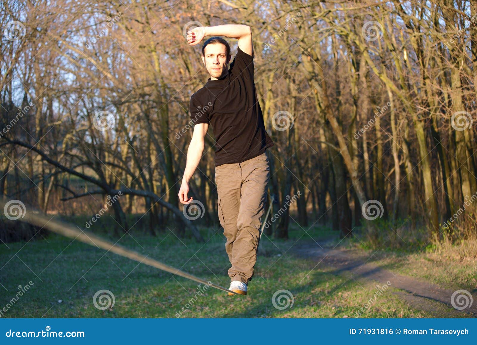 Man walking on slackline stock photo. Image of person 71931816