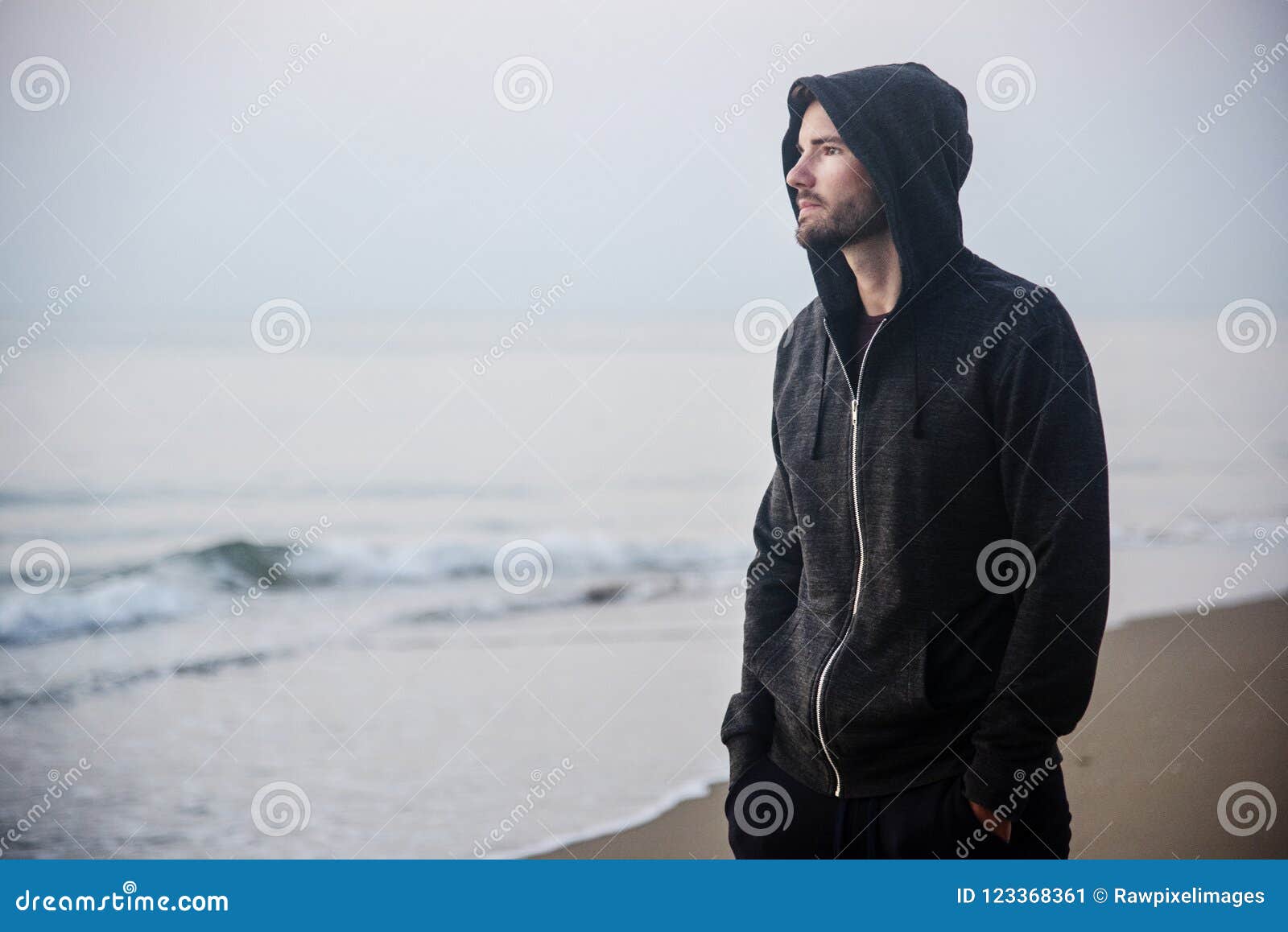 man walking in solitude at the beach