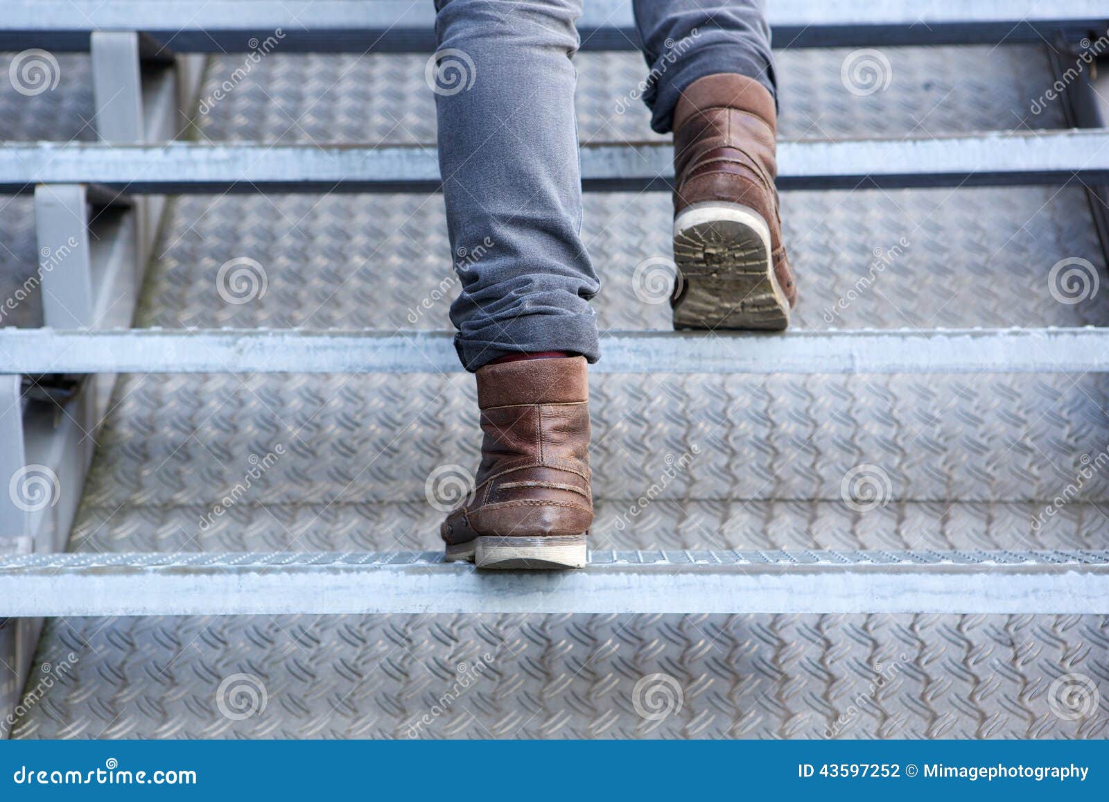 Man Walking Up Stairs in Boots Stock Photo Image of modern, brown