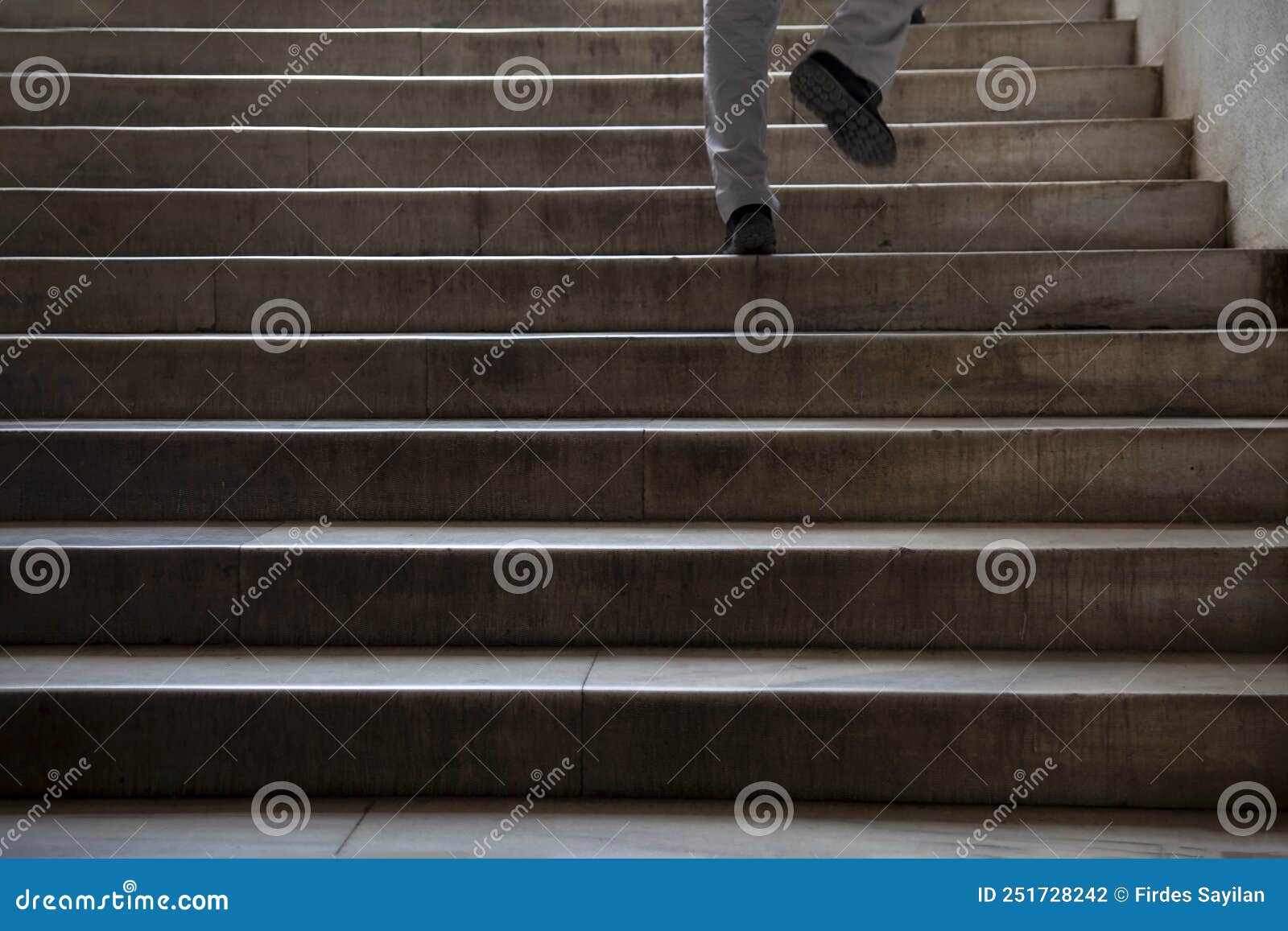 Man Walking on Stairs stock photo. Image of background 251728242