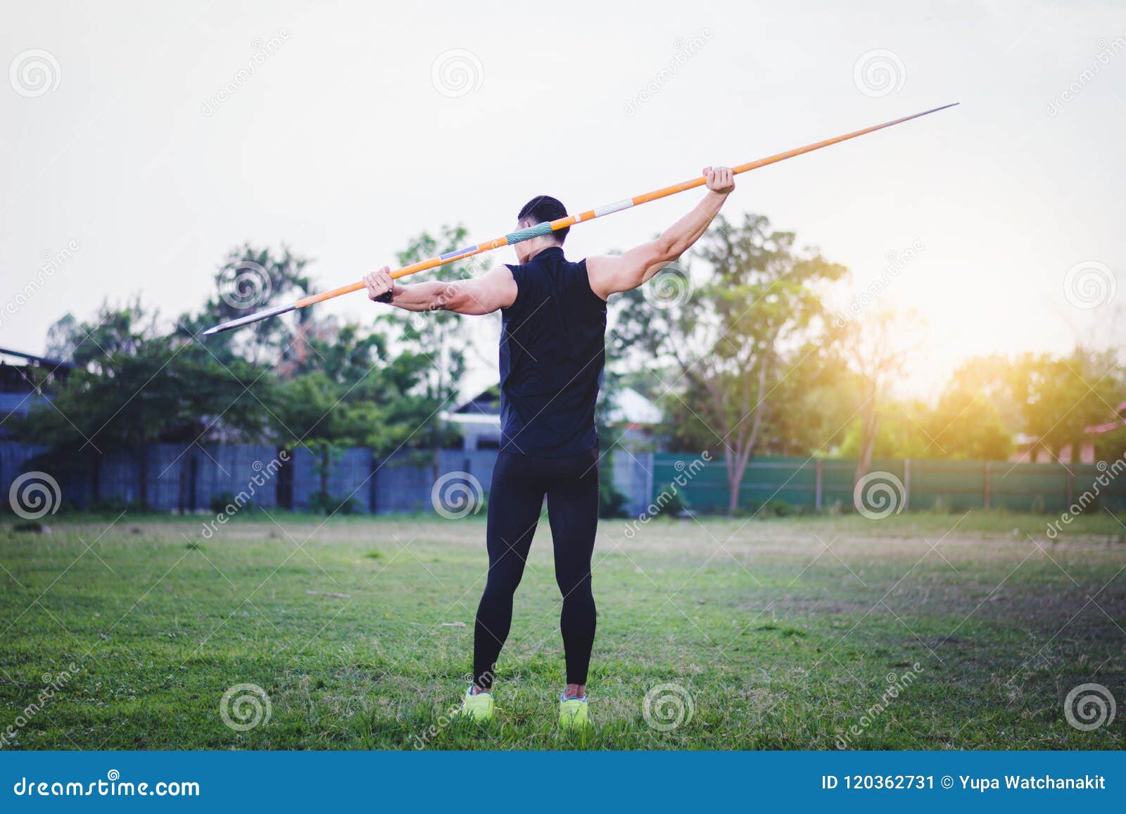 Man Warming Up and Practicing Javelin Throw in Yard Stock Image Image