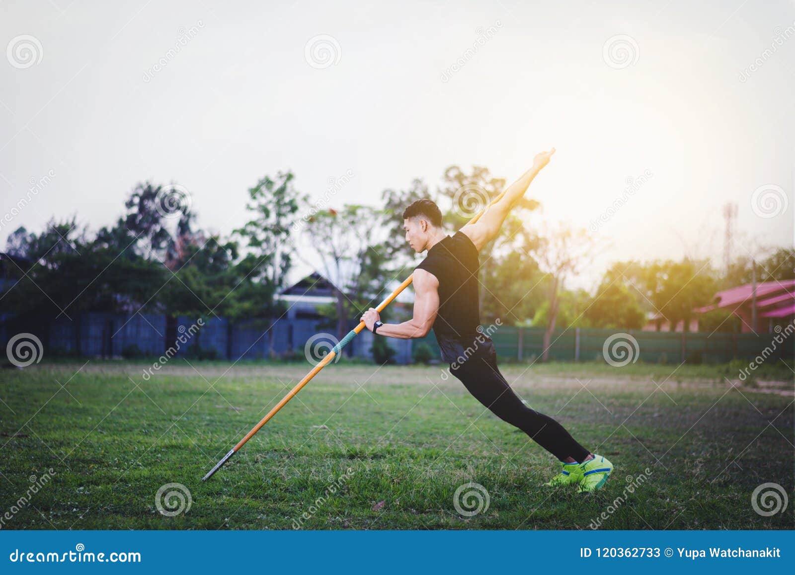 Man Warming Up and Practicing Javelin Throw in Yard Stock Image Image