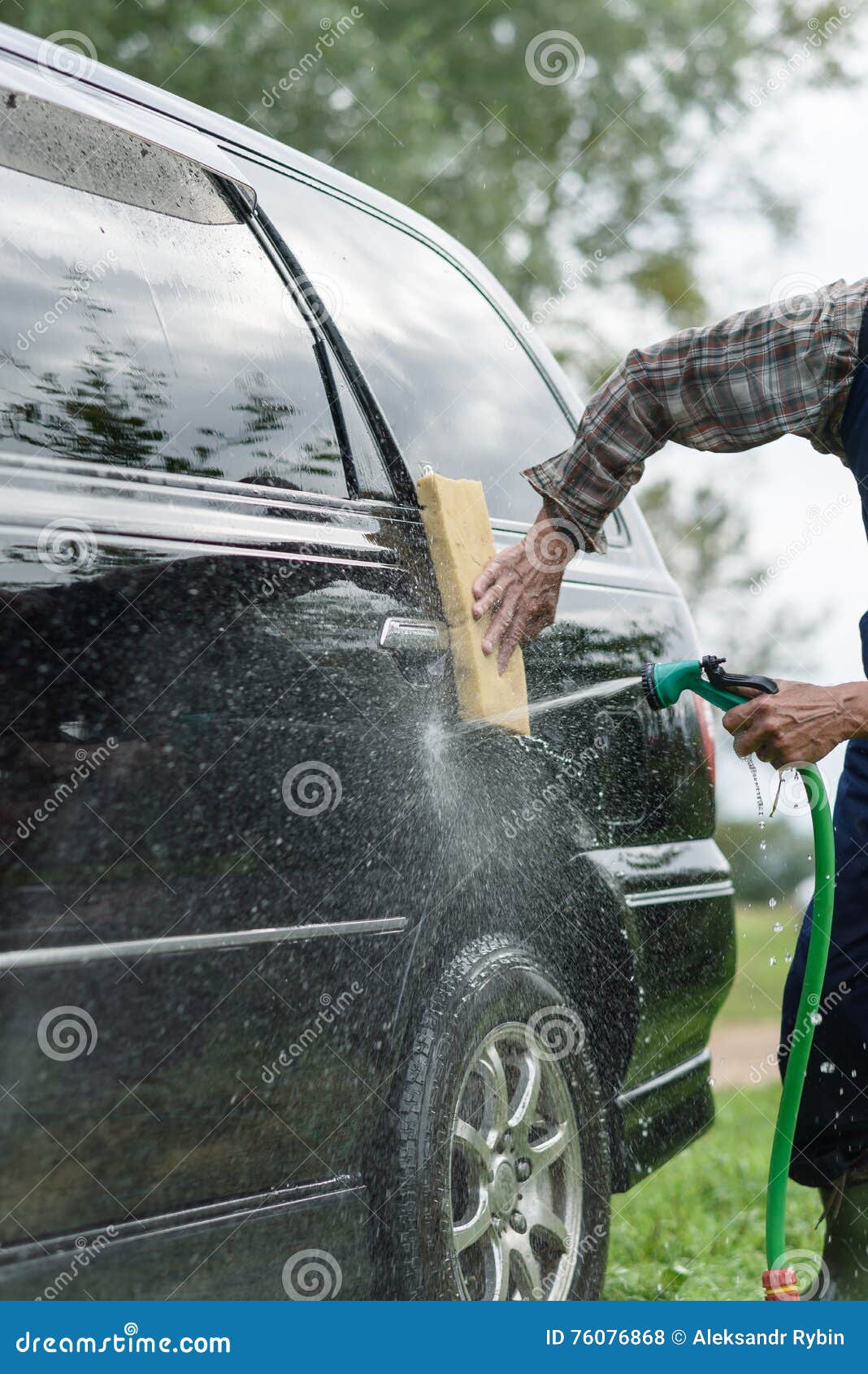 Man Washes His Car on Background of Green Garden Stock Photo Image of