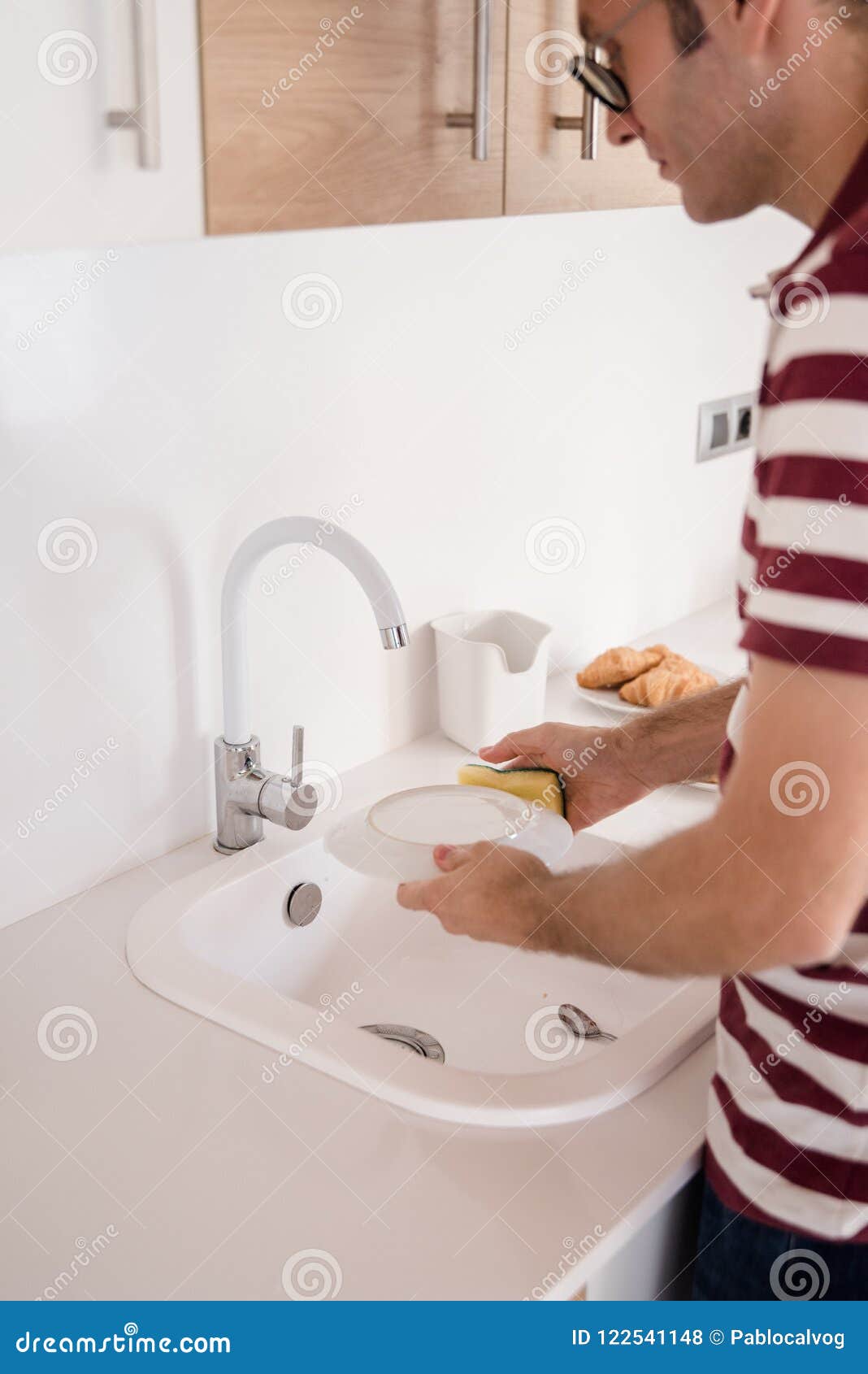 Man Washing Dishes in a Kitchen Stock Photo Image of plate, shirt 122541148
