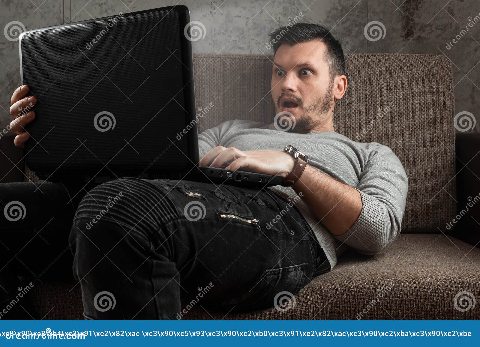 A Man Watches An Adult Video On A Laptop While Sitting On ...