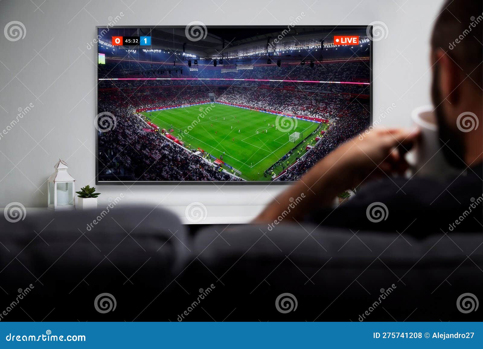 Man Watching Football Match on Smart TV