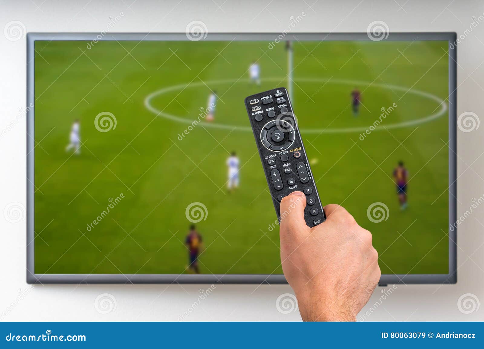 Man is Watching Football Match on TV Editorial Stock Image