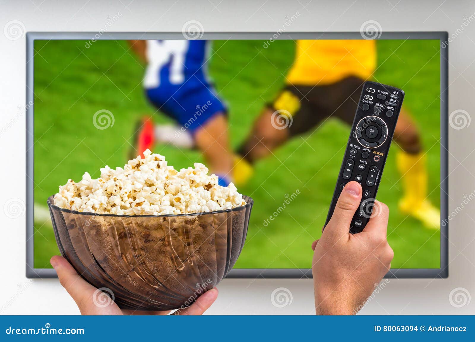 Man is Watching Football Match on TV Editorial Stock Image