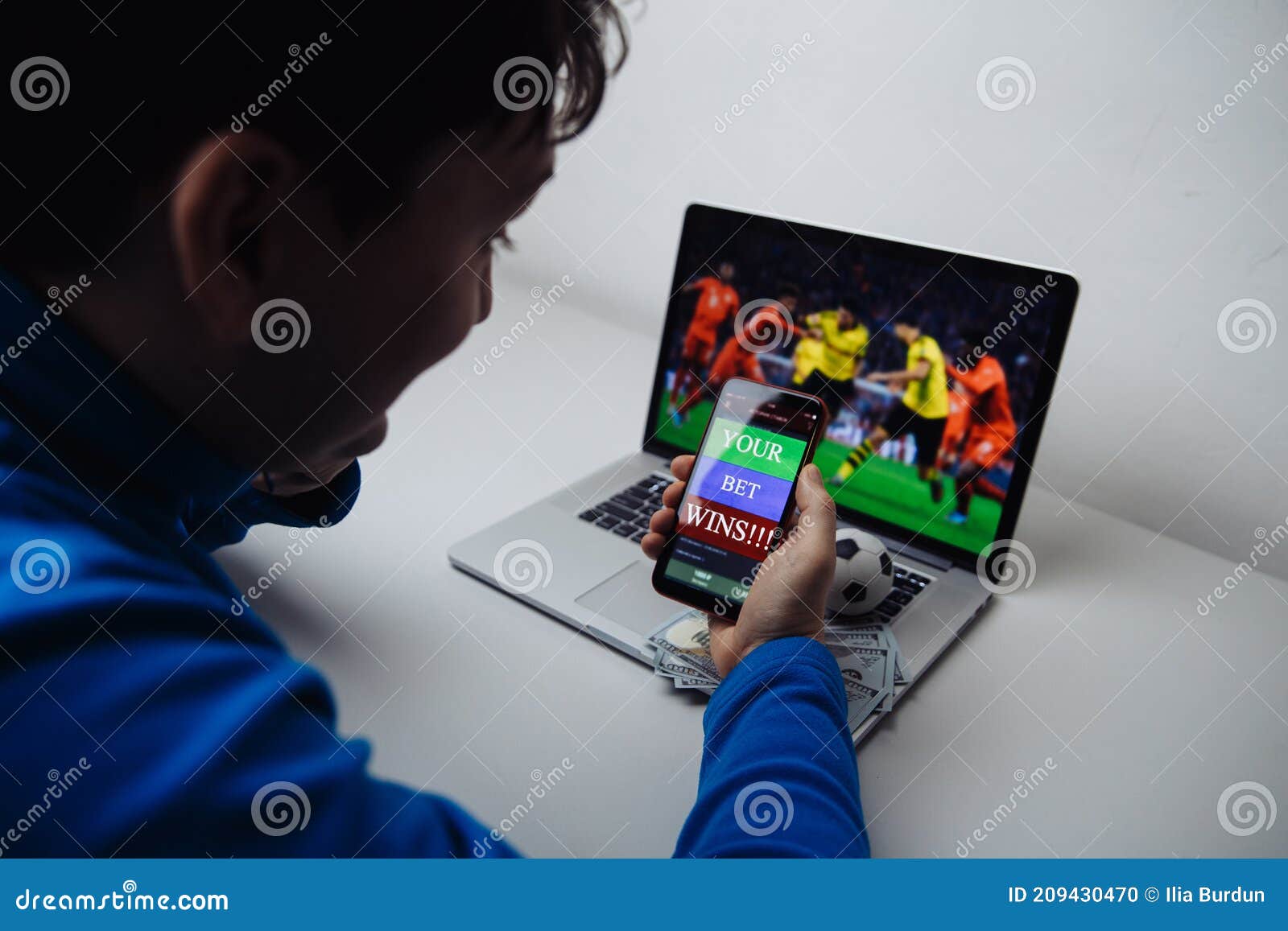 Man Watching Football Online Broadcast on His Laptop and Celebrate Victory in Betting at Bookmaker S Website