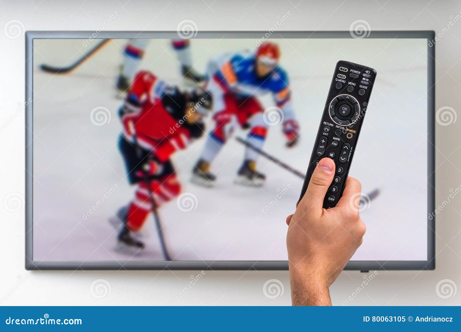 Man is Watching Hockey Match on TV Editorial Image