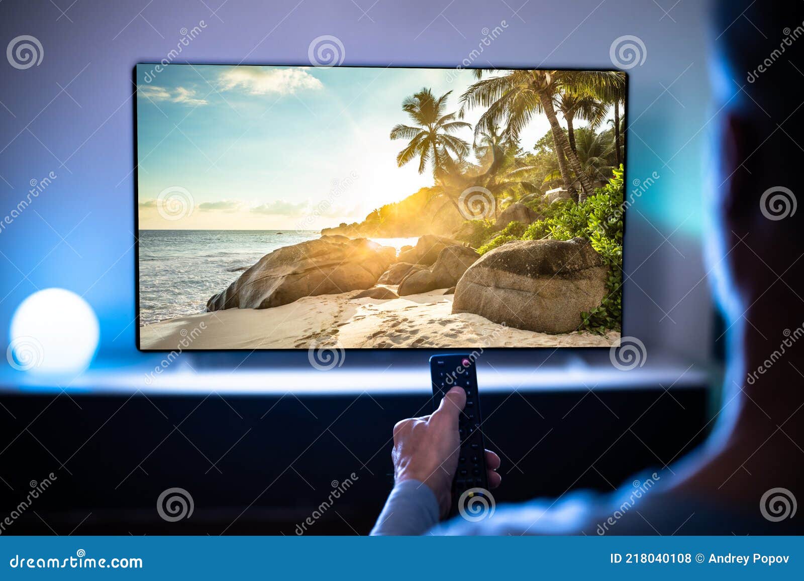 Man Watching Live TV in Room Stock Photo