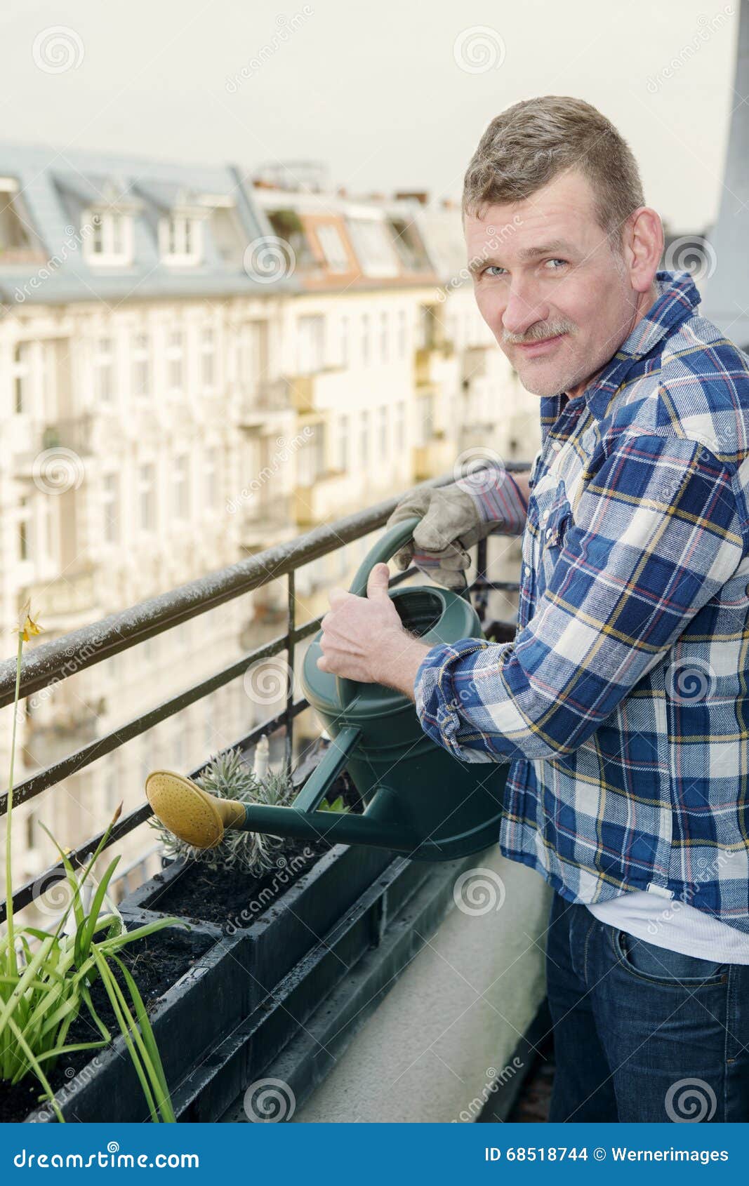 Man Watering Plants on Balcony Stock Photo Image of retirement