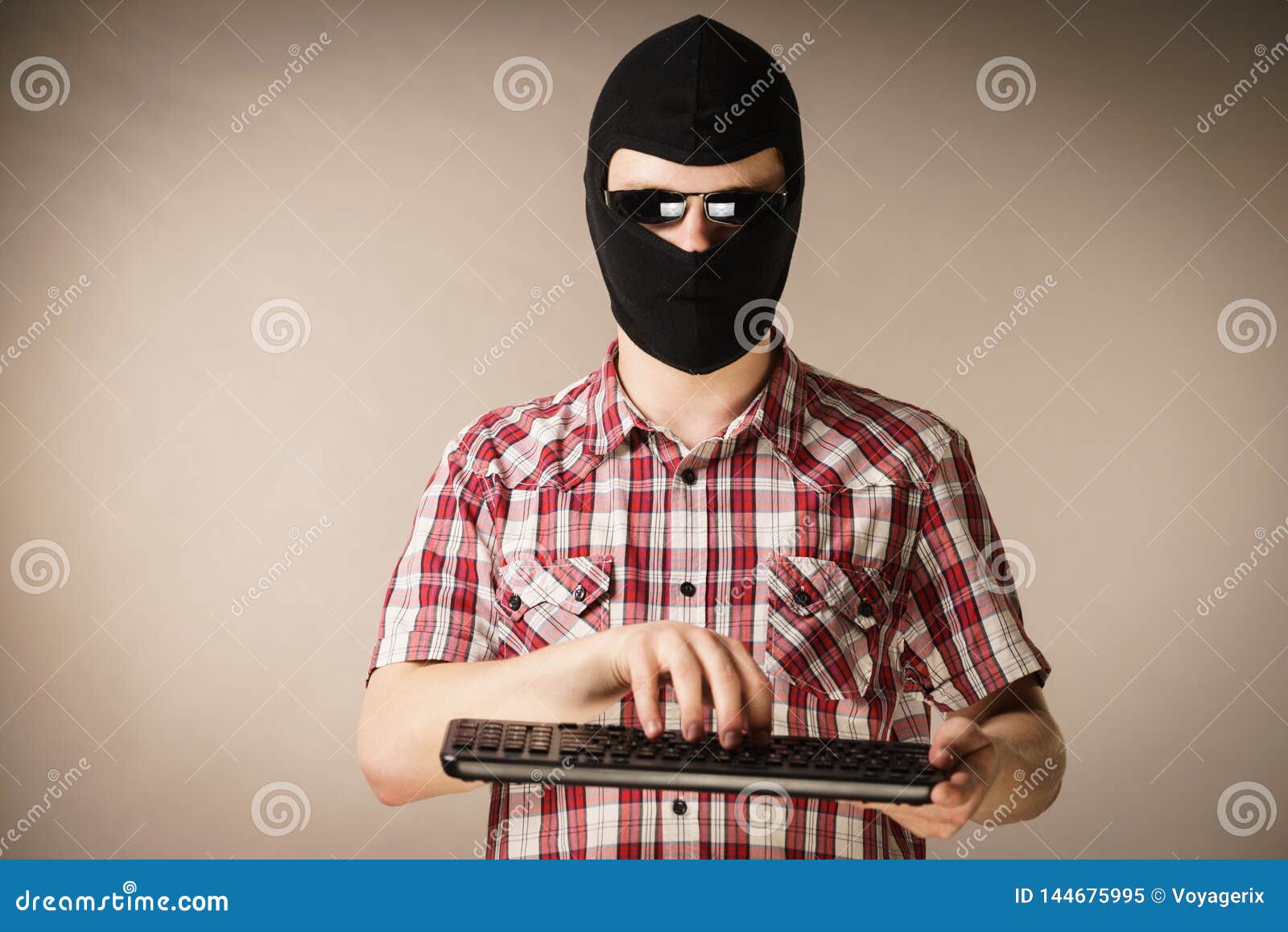 Man Wearing Balaclava Holding Keyboard Stock Image Image of keyboard