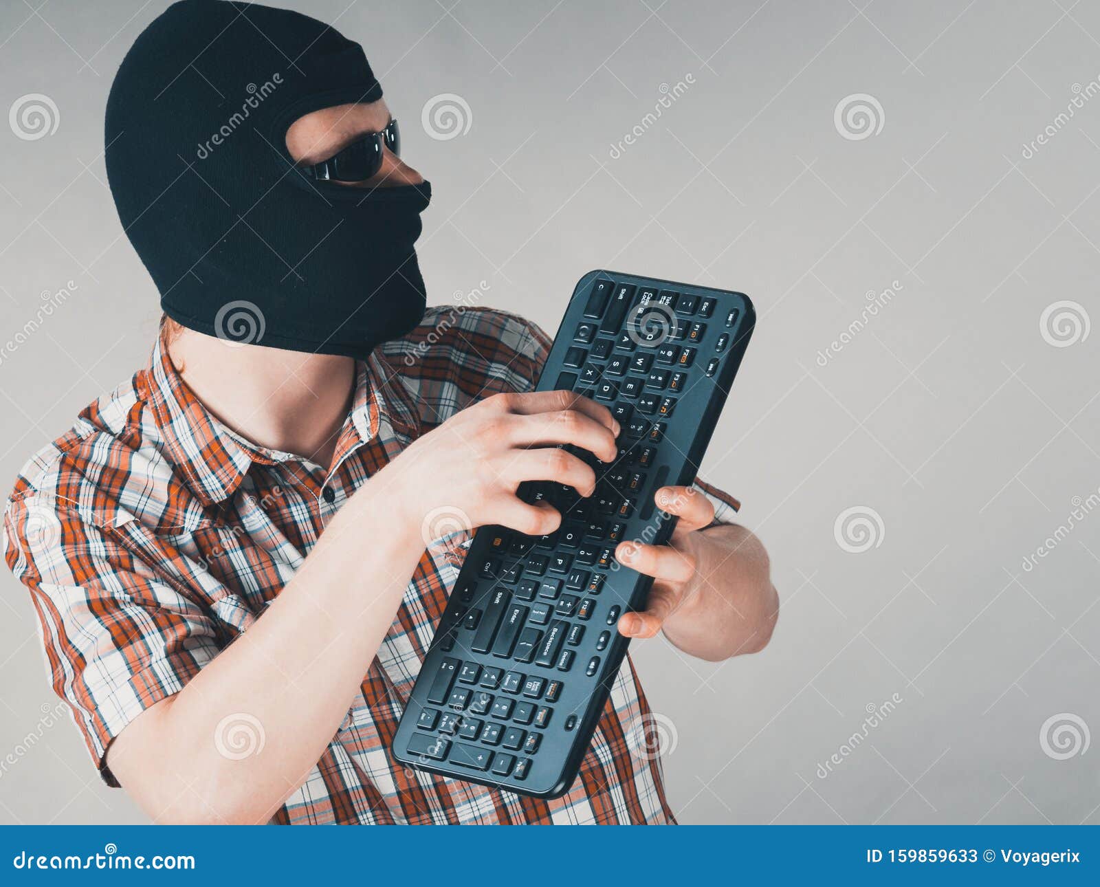 Man Wearing Balaclava Holding Keyboard Stock Image Image of problem