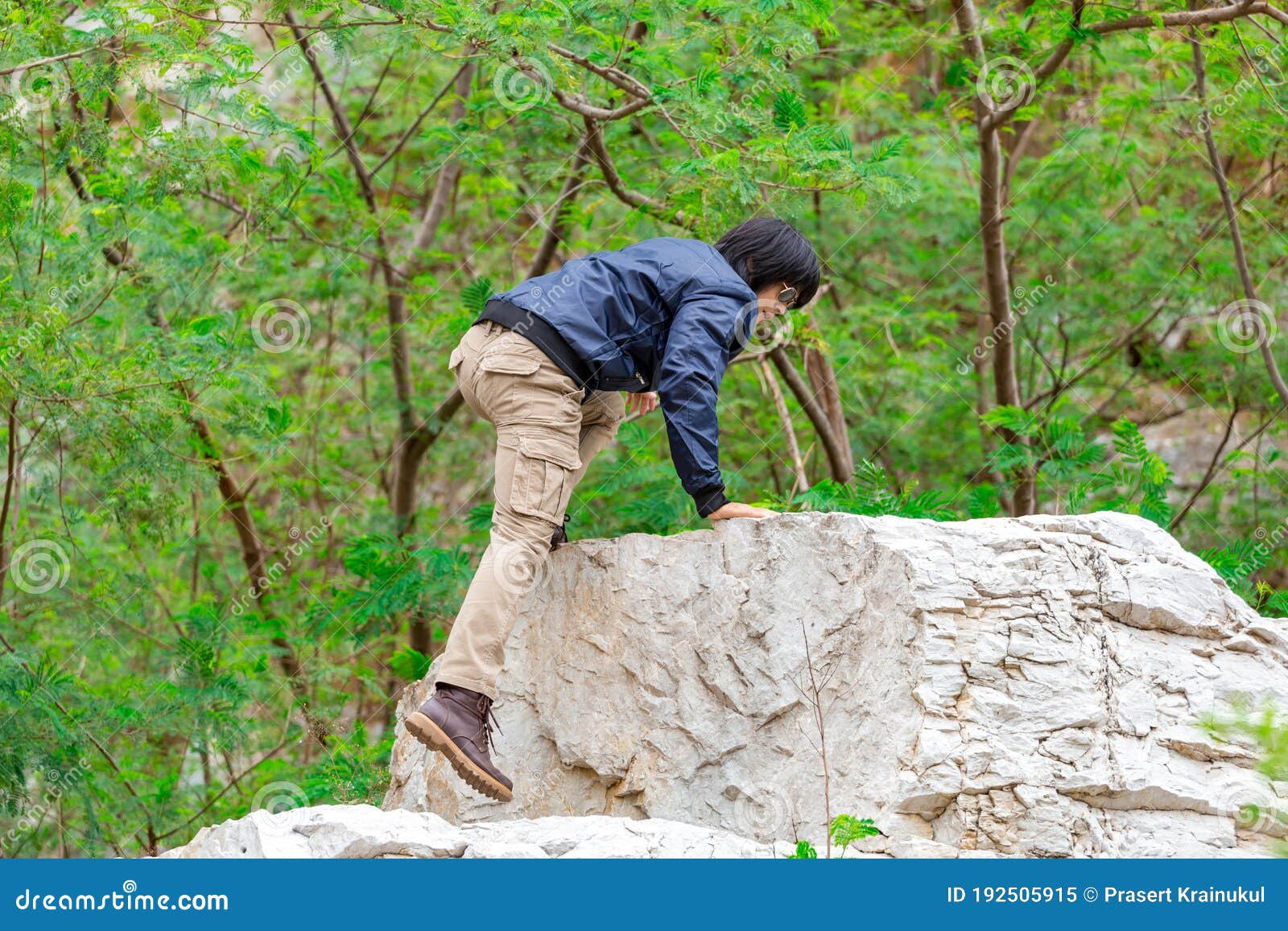 Man Wearing Cargo Pants and Climbing on the Rock Stock Image Image of
