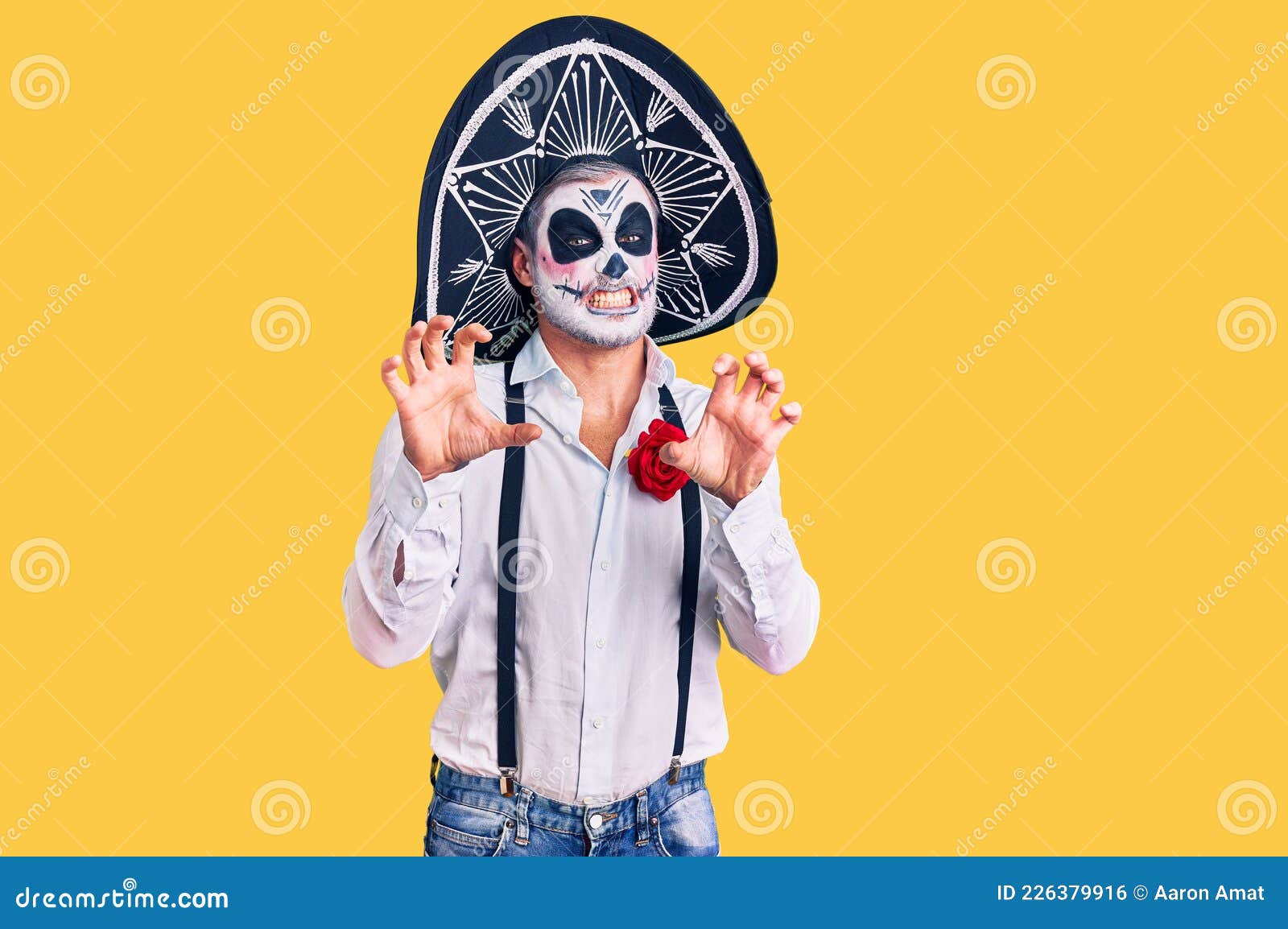 Man Wearing Day of the Dead Costume Over Background Smiling Funny Doing