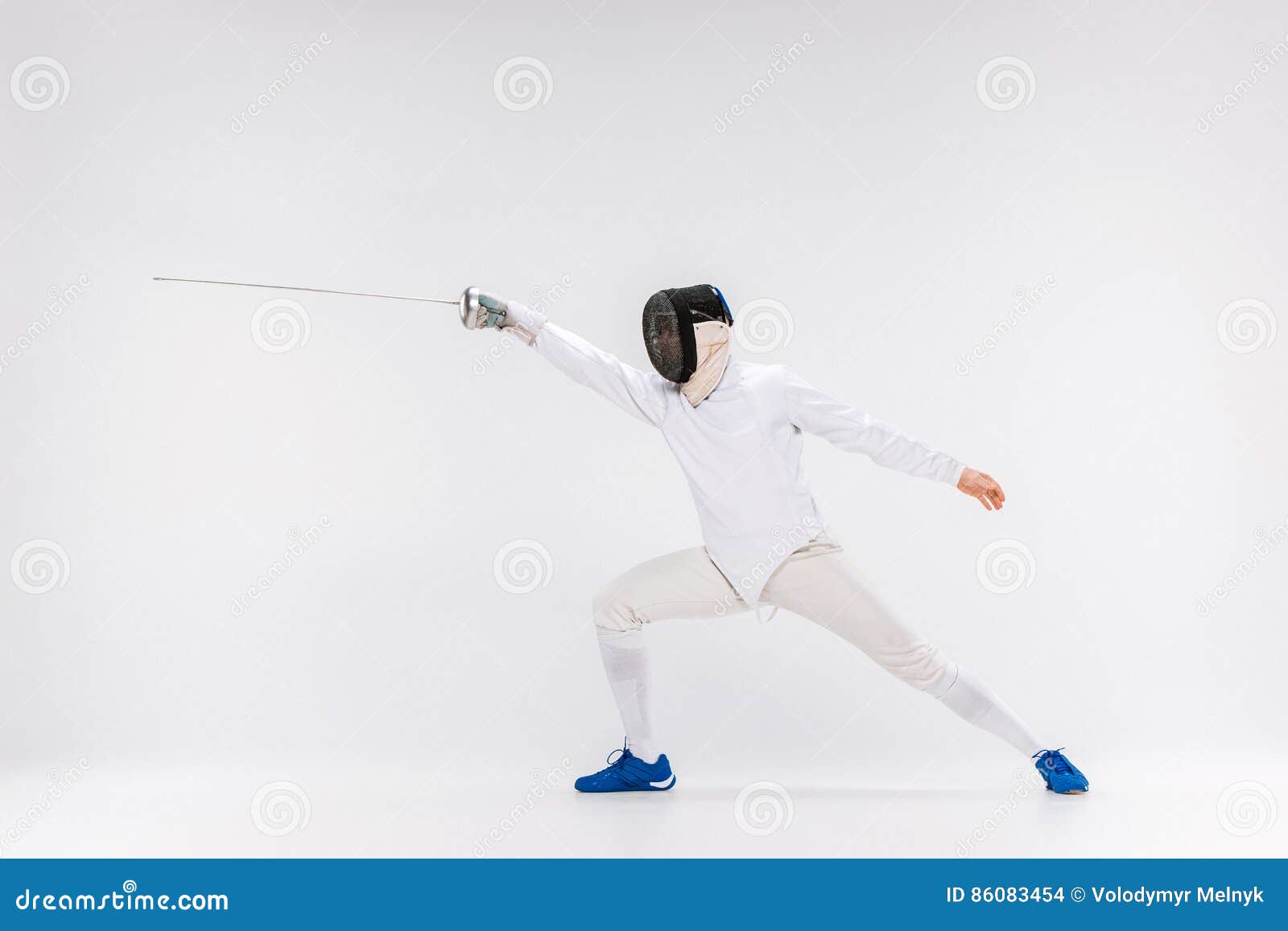 Man Wearing Fencing Suit Practicing With Sword Against Gray Stock Photo Image of lifestyle
