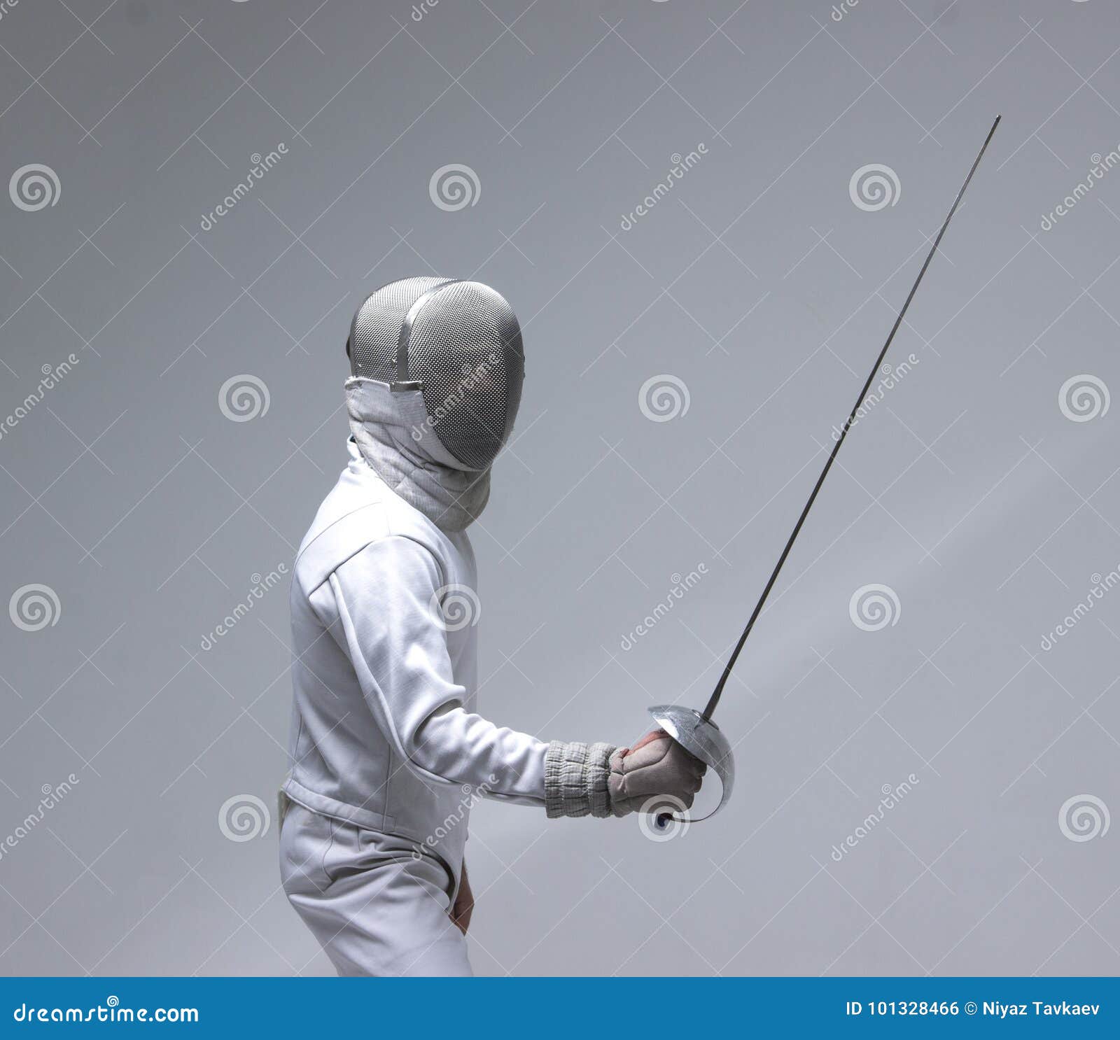 man wearing fencing suit practicing with sword
