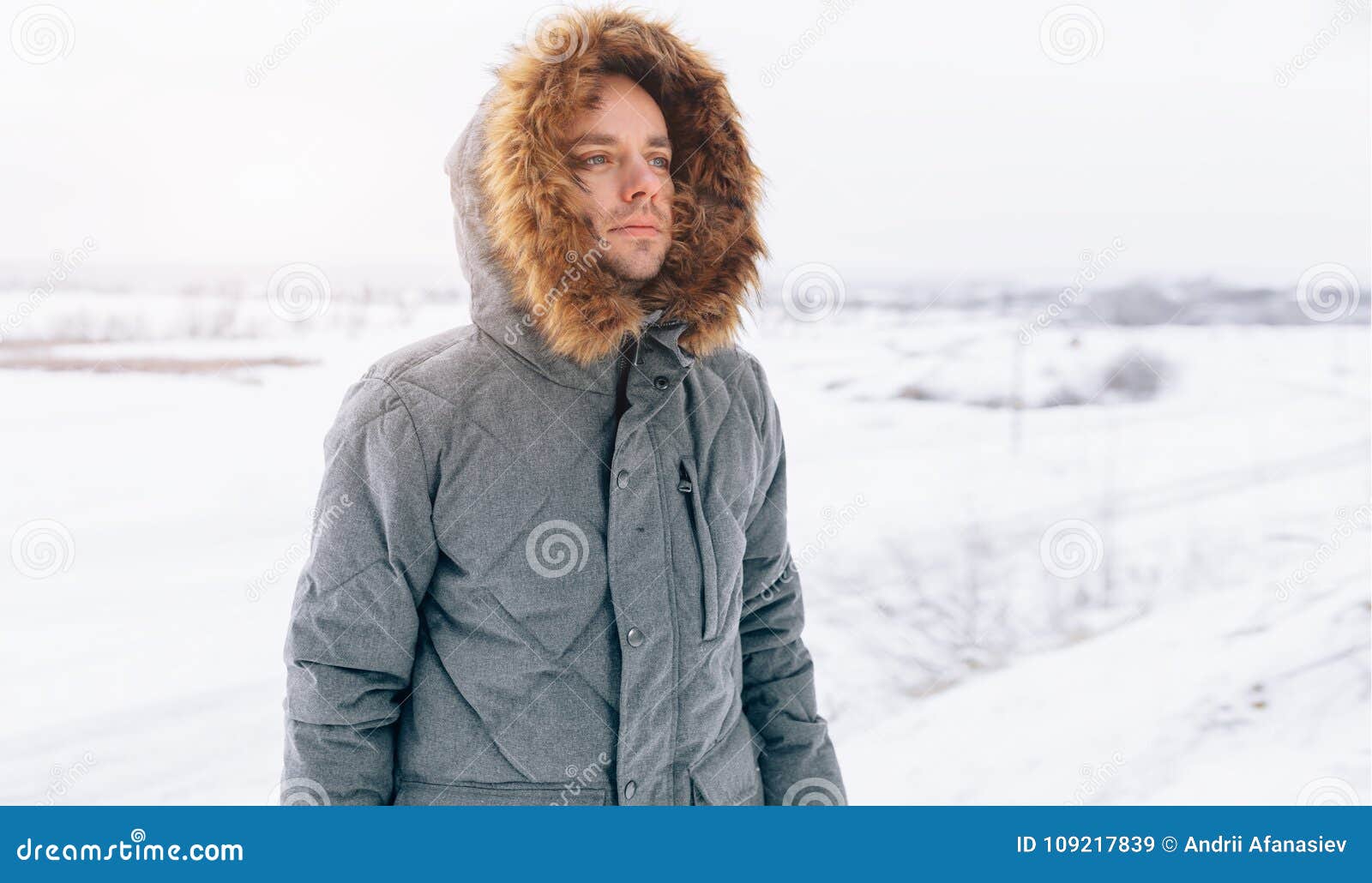 Man Wearing Gray Winter Jacket with Hood on in Winter Snow Stock Image ...