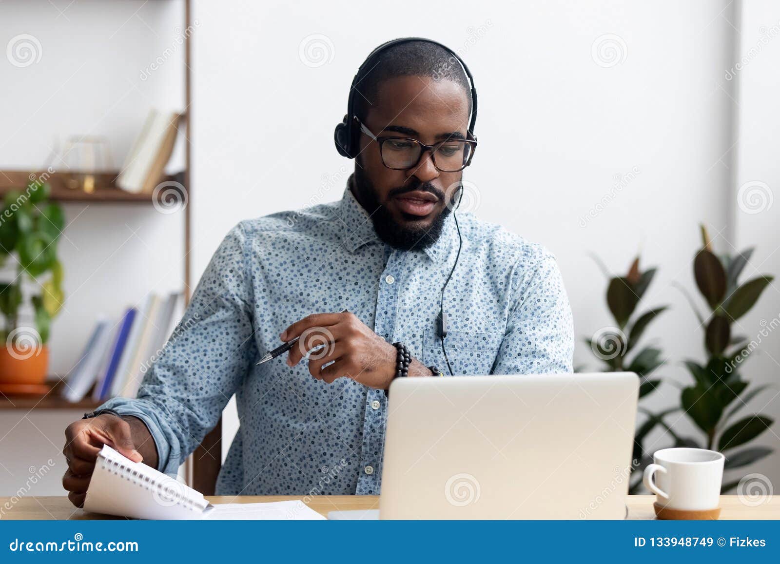 man wearing headphones learn foreign language indoors