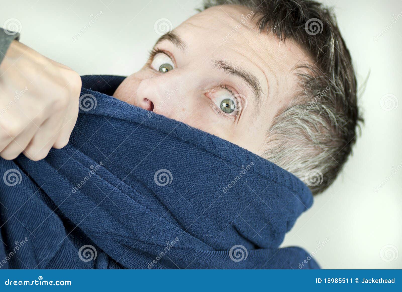 man wearing housecoat being yanked off camera