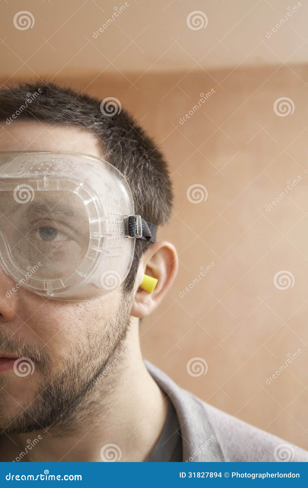 Man Wearing Protective Goggles and Earplugs Stock Photo Image of
