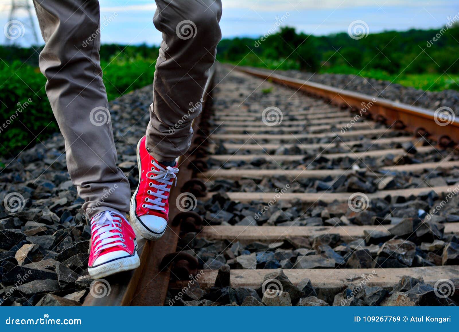 man wearing converse shoes