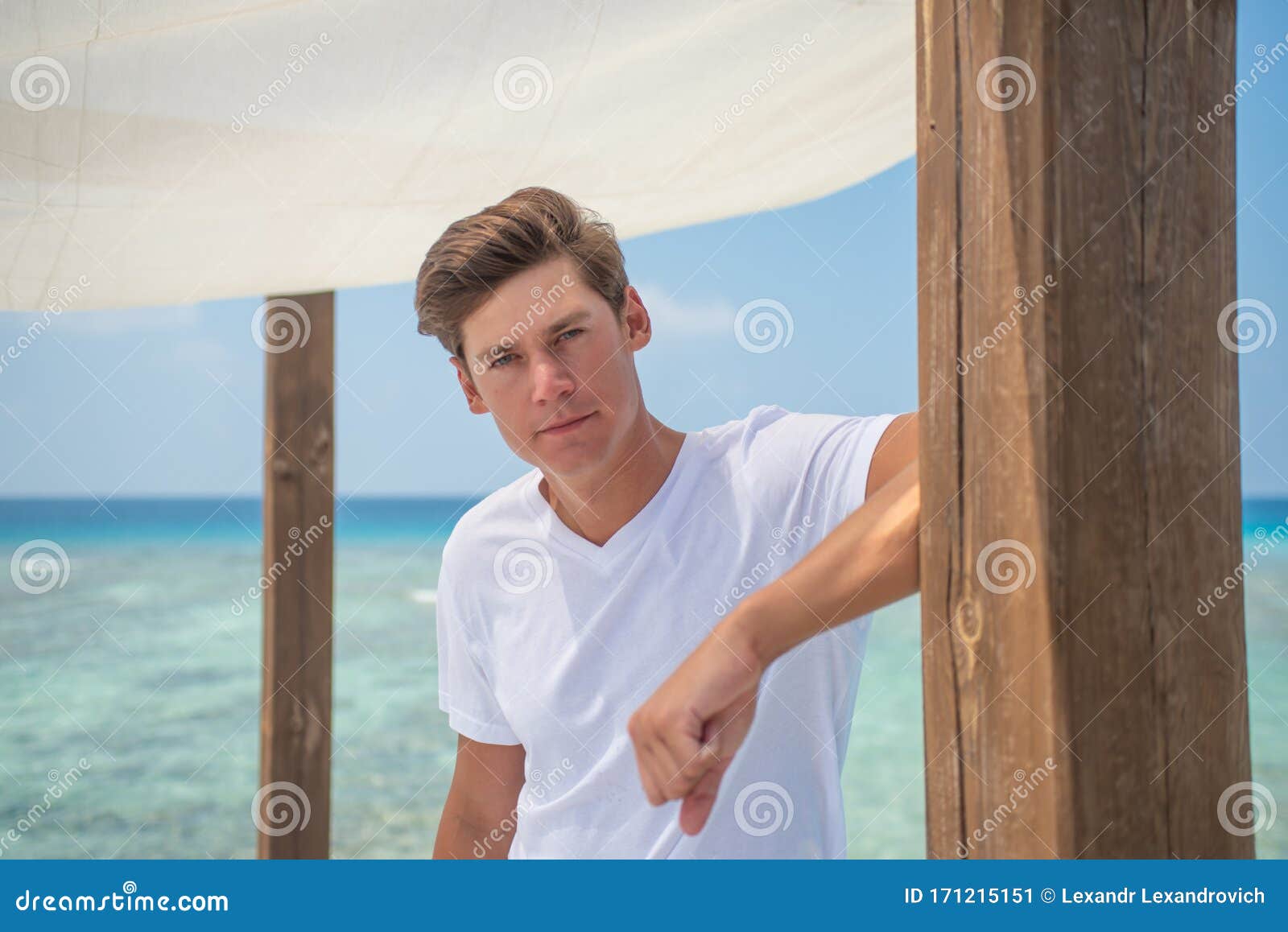 Man Wearing T-shirt and Shorts Posing at Tropical Beach at Island ...