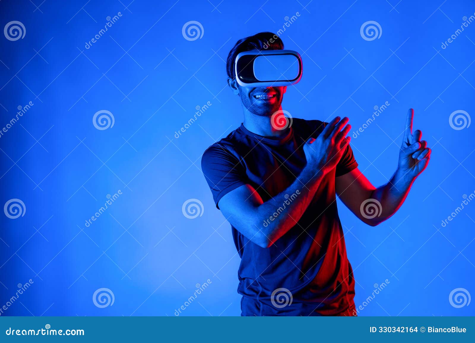 man wearing virtual reality goggle while standing at neon light. deviation.