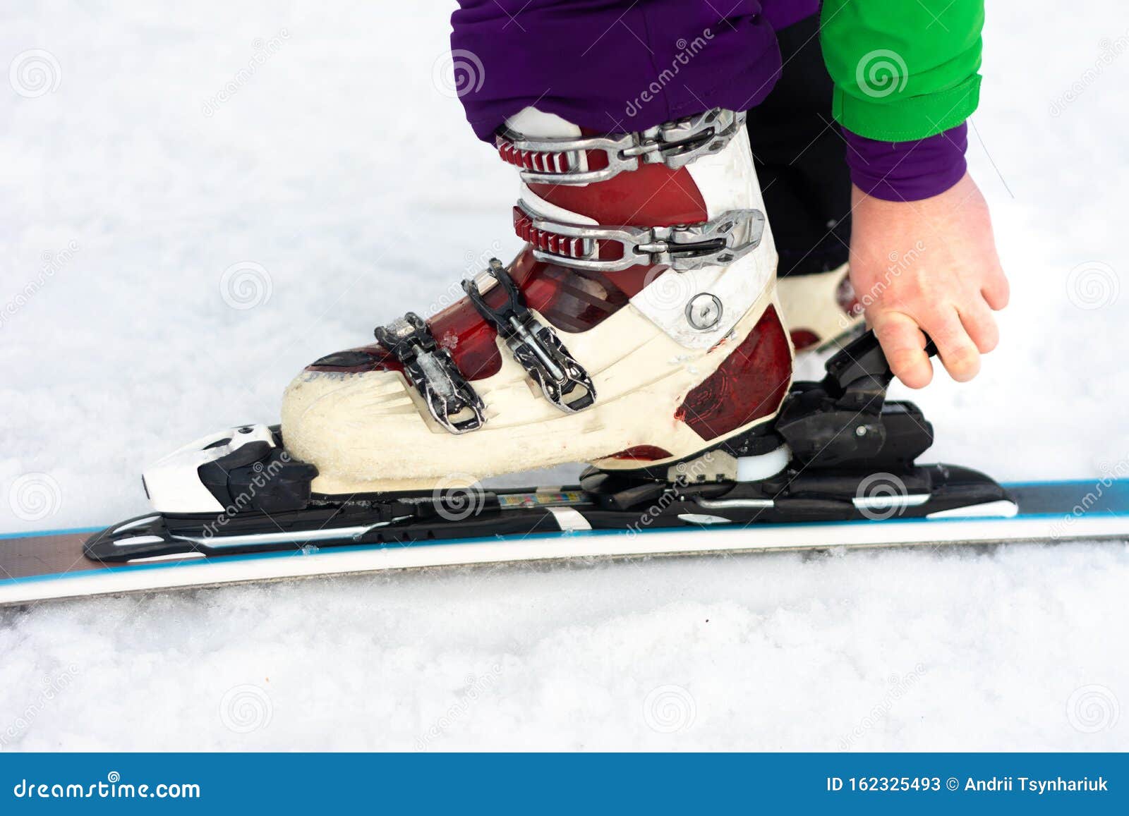 A Man is Wearing White Ski Boots in the Snow Stock Image Image of