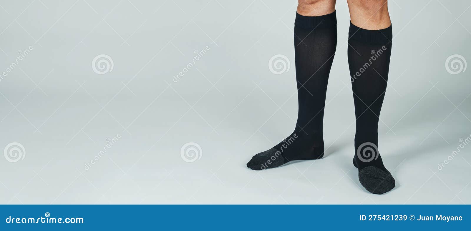 man wears compression socks, banner format