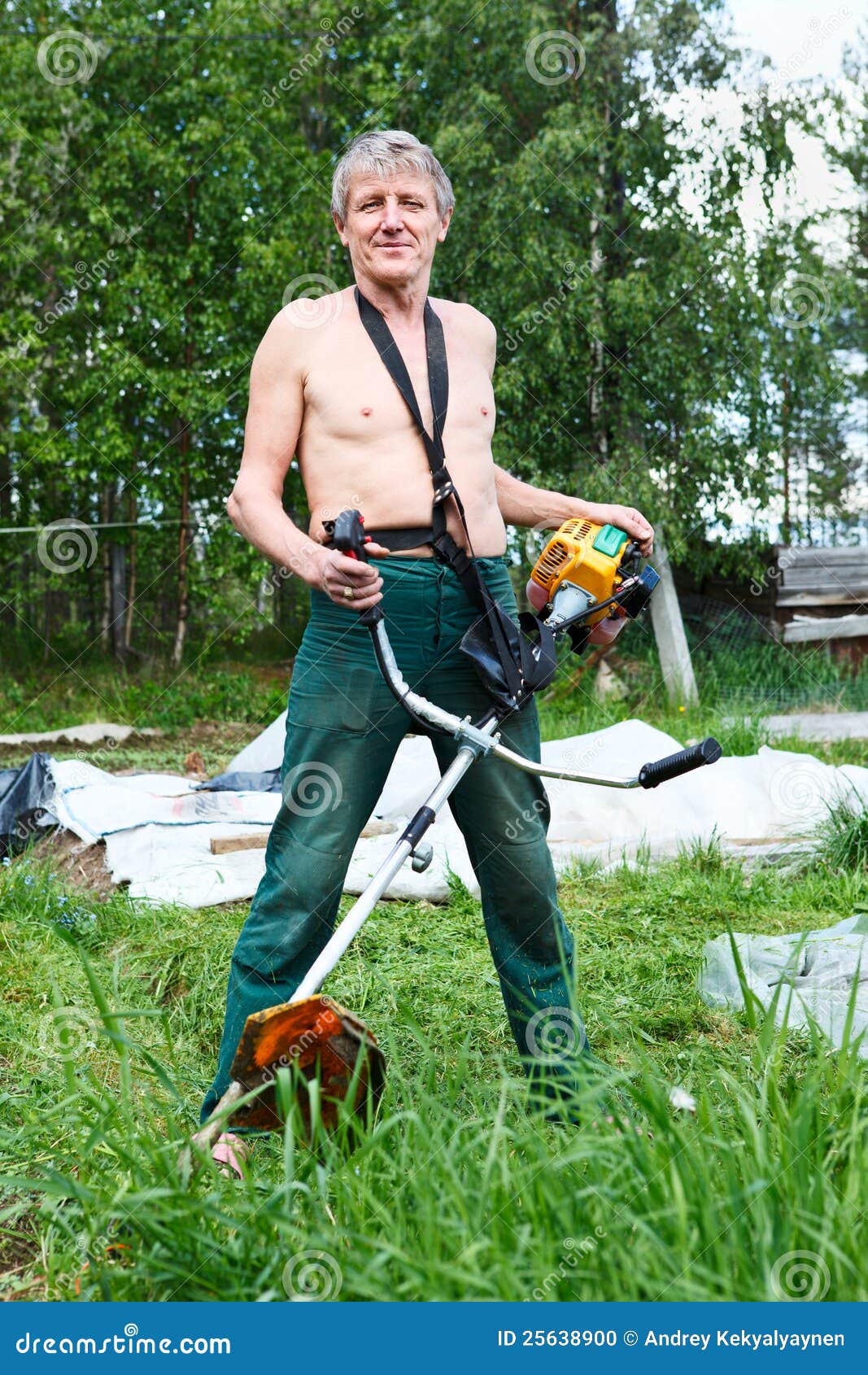 Man with weed trimmer stock photo. Image of green, gardening - 25638900