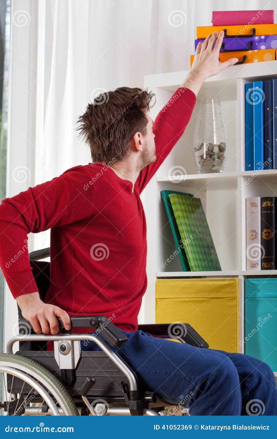 man on wheelchair during everyday task