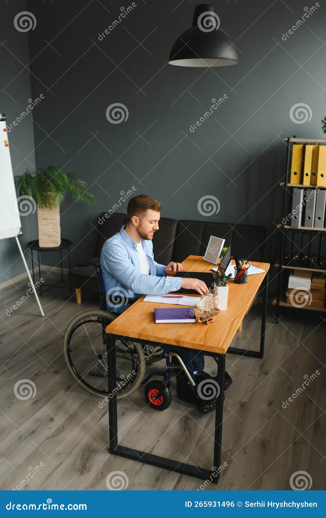 Man in Wheelchair at Home or in Office. Stock Photo Image of