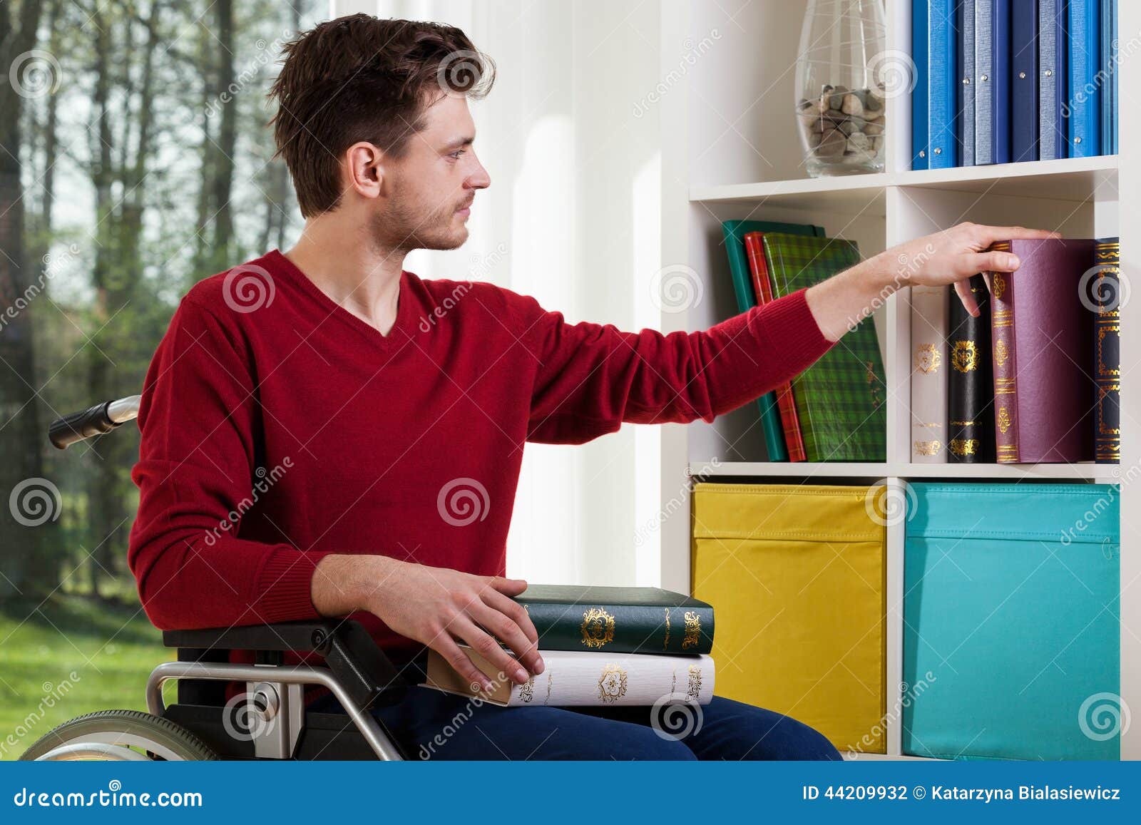 Man on Wheelchair Placing Books Stock Photo Image of handicap, happy