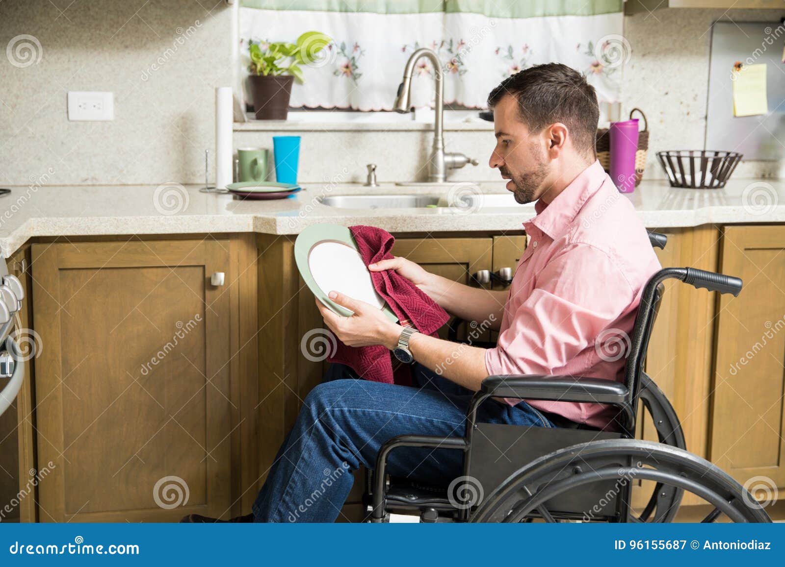Man on Wheelchair Washing Dishes Stock Image Image of young, cleaning 96155687