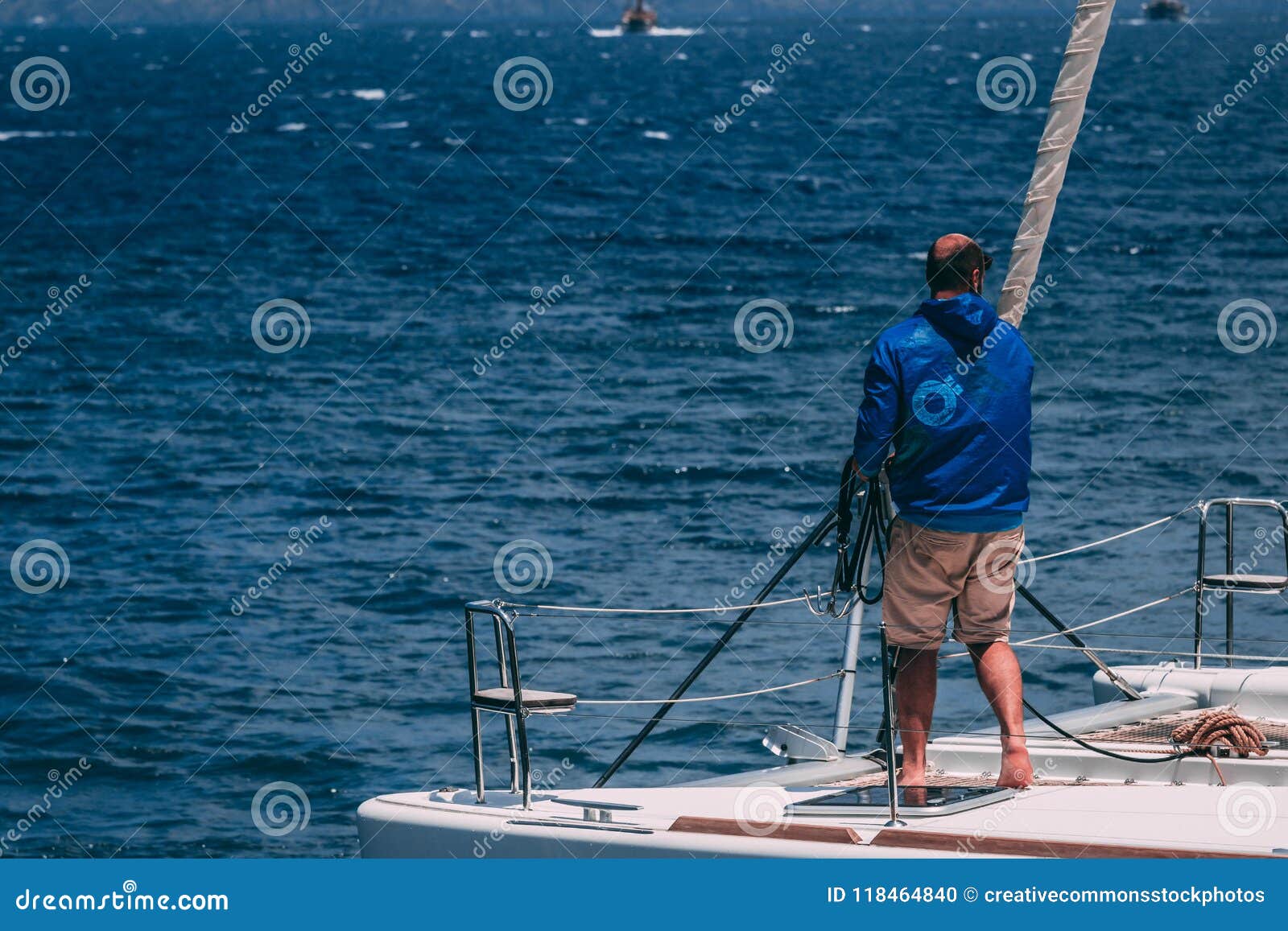 Man In White Hooded Jacket Riding On Boat Picture. Image 118464840