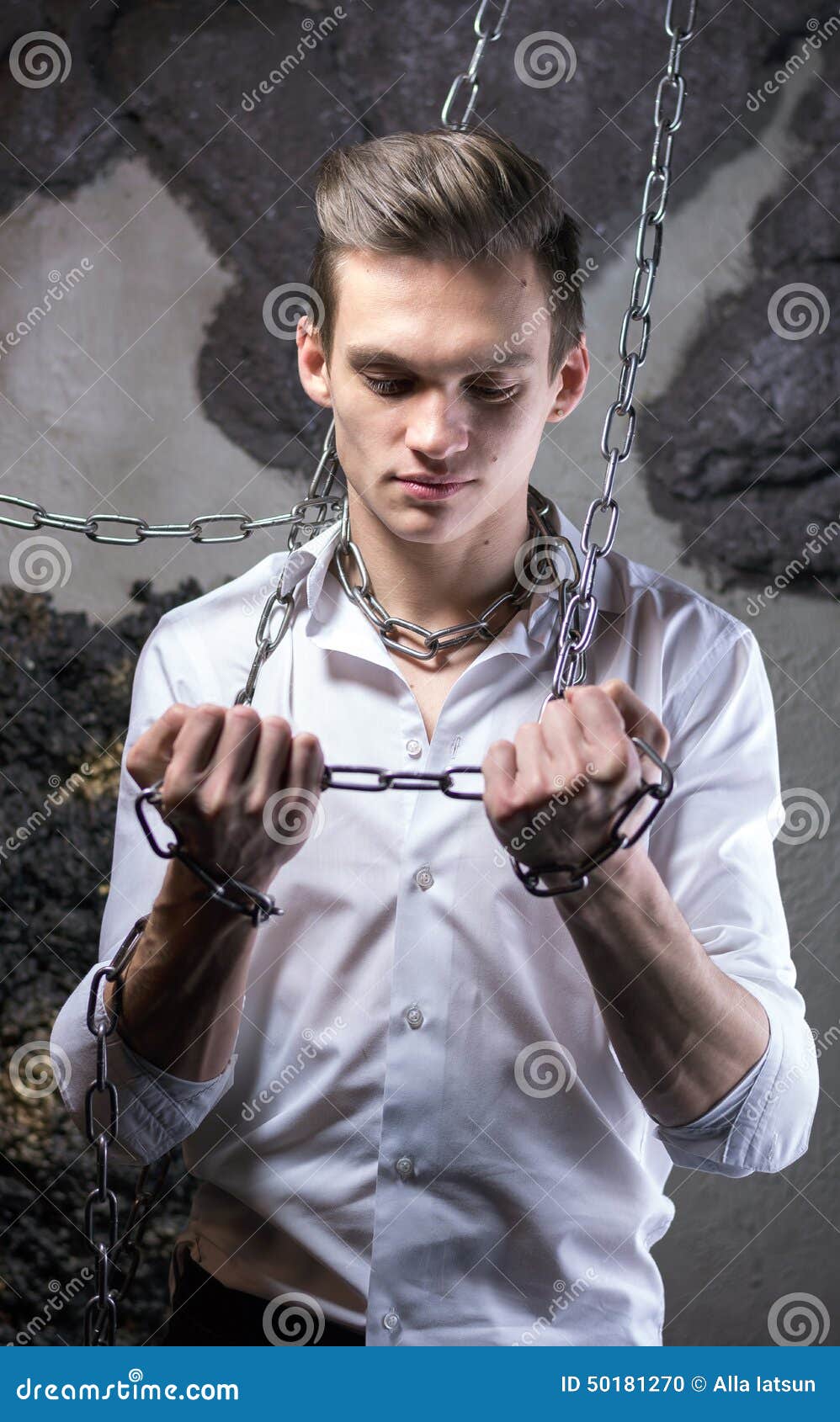 A Man in a White Shirt and Tie Breaks the Chain. Stock Photo Image of