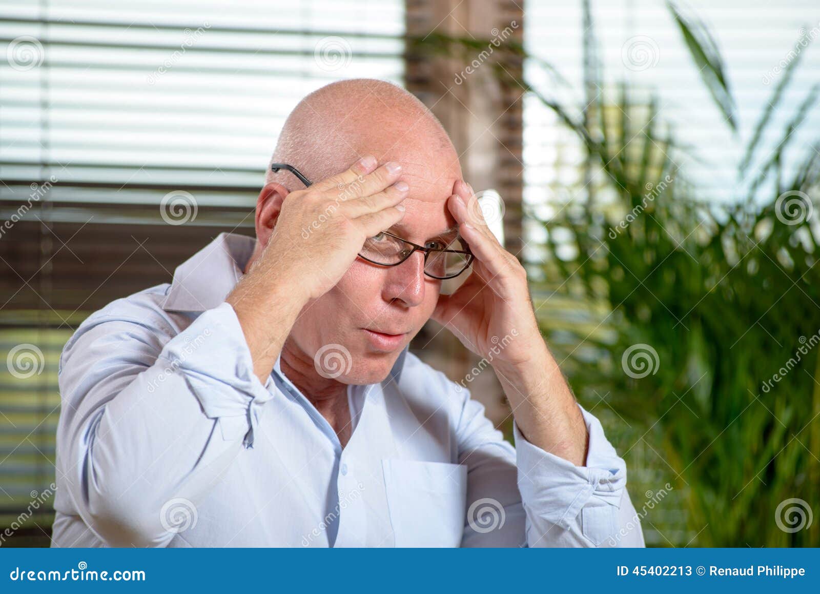 A man who has a headache stock image. Image of male, people 45402213