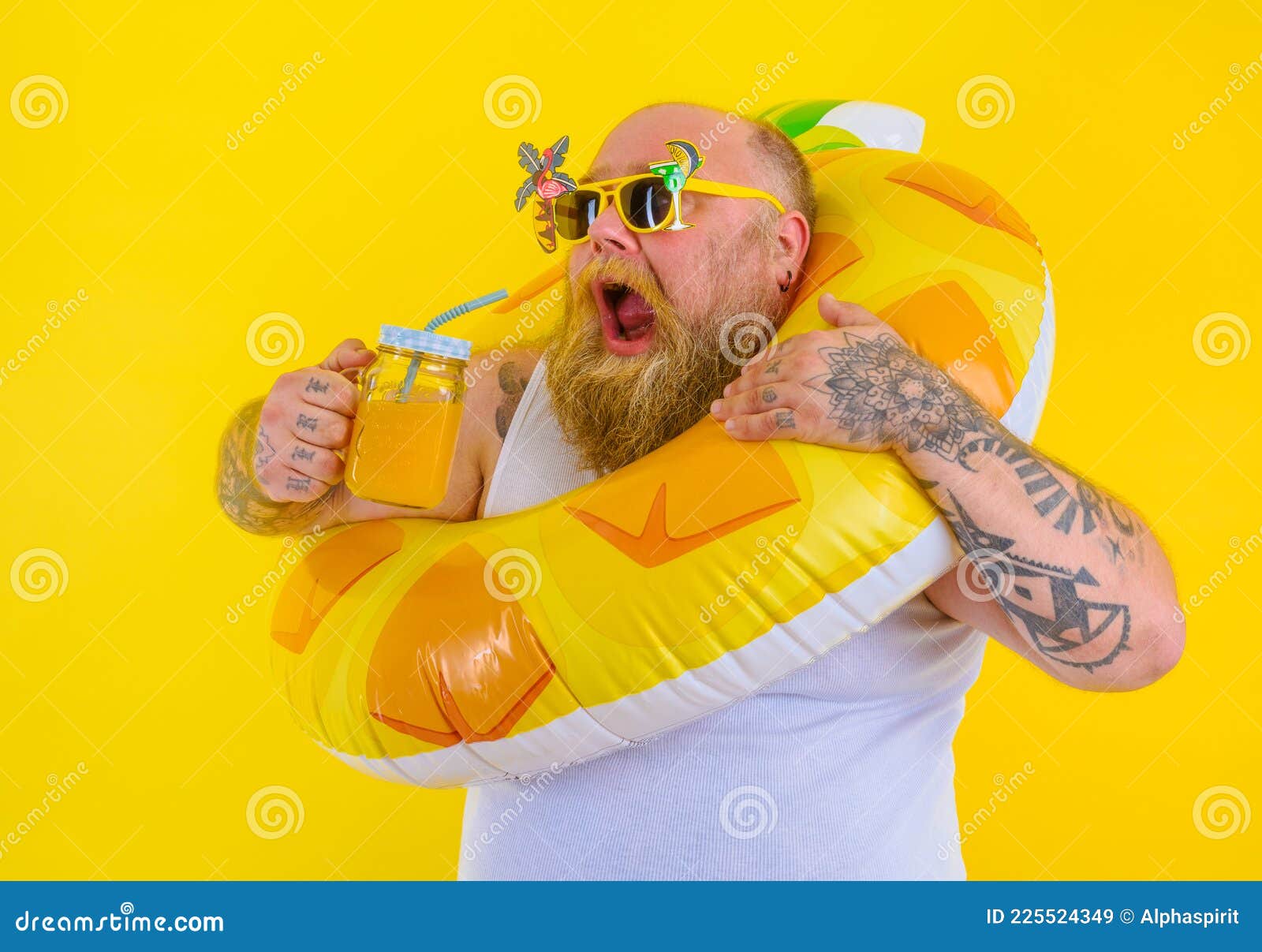 fat hungry man with wig in head is ready to swim with a donut lifesaver