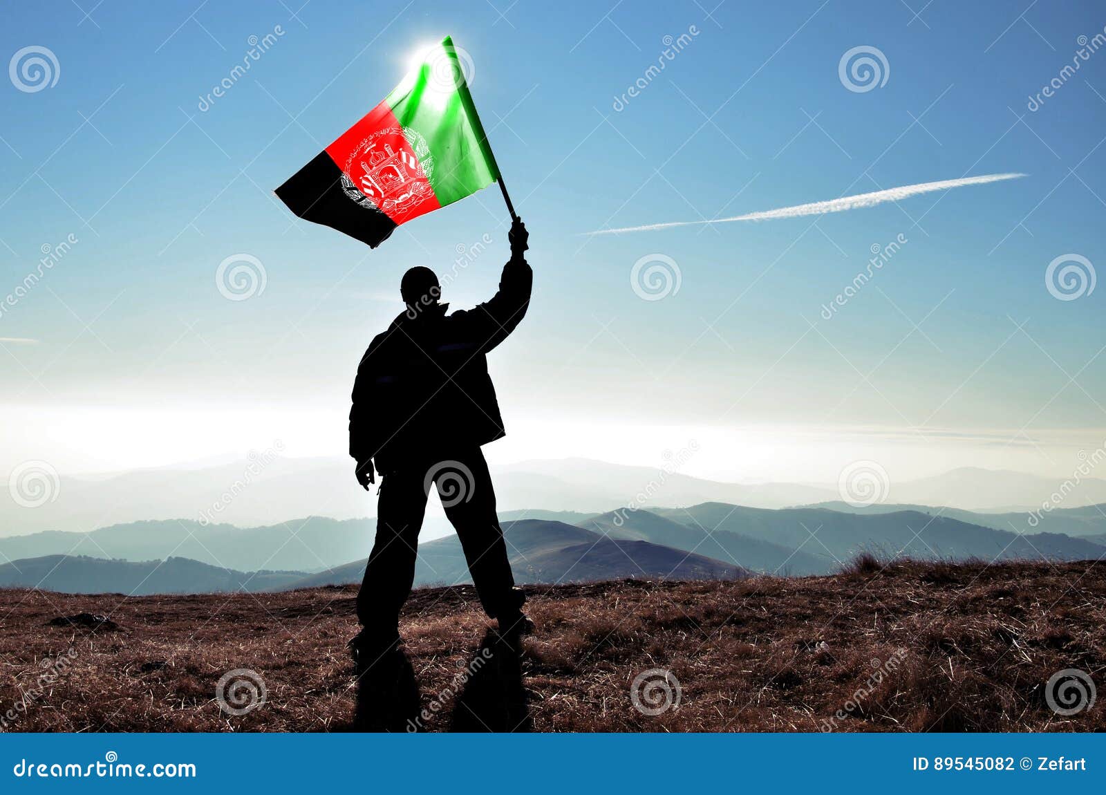 man winner waving afganistan flag