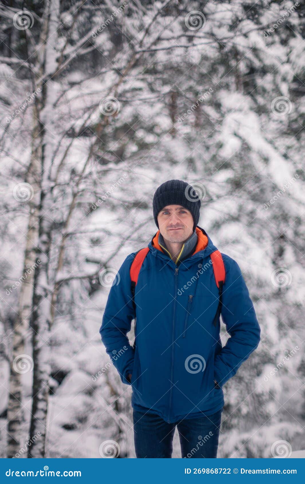Man in Winter Jacket Walking in Snowy Winter Forest Stock Photo Image